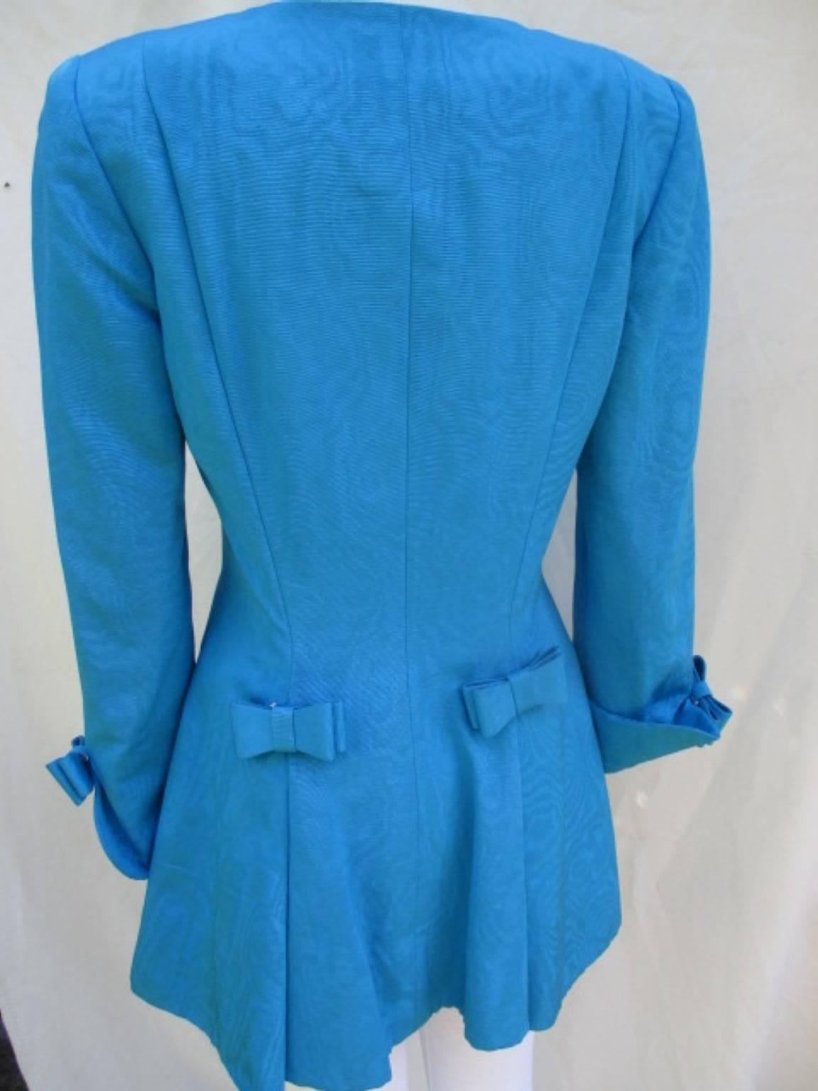 Women's or Men's Nina Ricci paris turquoise bows jacket with skirt  For Sale