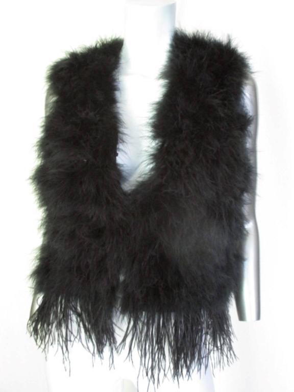 This vest is made of marabou/ ostrich feathers and has 2 closing hooks.

We offer more luxurious fur items, view our frontstore.

Details:
Color, black
Appears to be small US 6-8/ EU 36 -38, please refer to the measurements in the