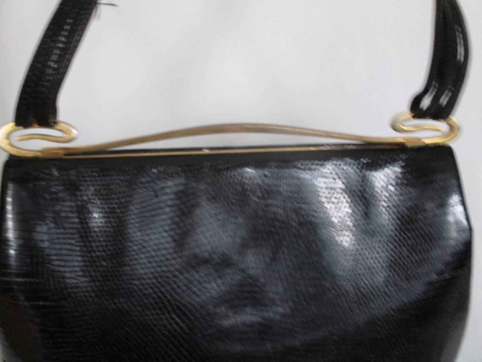 Delvaux vintage lizard bag -collectors item-
Modele depose 
Gold hardware
Inside is made of soft suède leather
Condition very good with minor wear at the gold hardware
Measurements:
26 cm x 16 cm x 8 cm
10.23 inch x 6.29 inch x 2.75 inch

Delvaux is