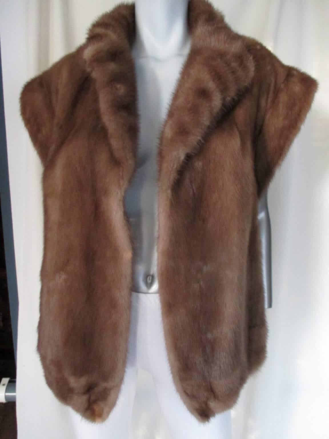 This mink fur jacket is made of very soft mink and can be worn sleeveless or with the knitted sleeves with zippers.
It has 2 pockets and 3 closing hooks
Condition of the mink fur is excellent, only some wear at the suede at the inside at the