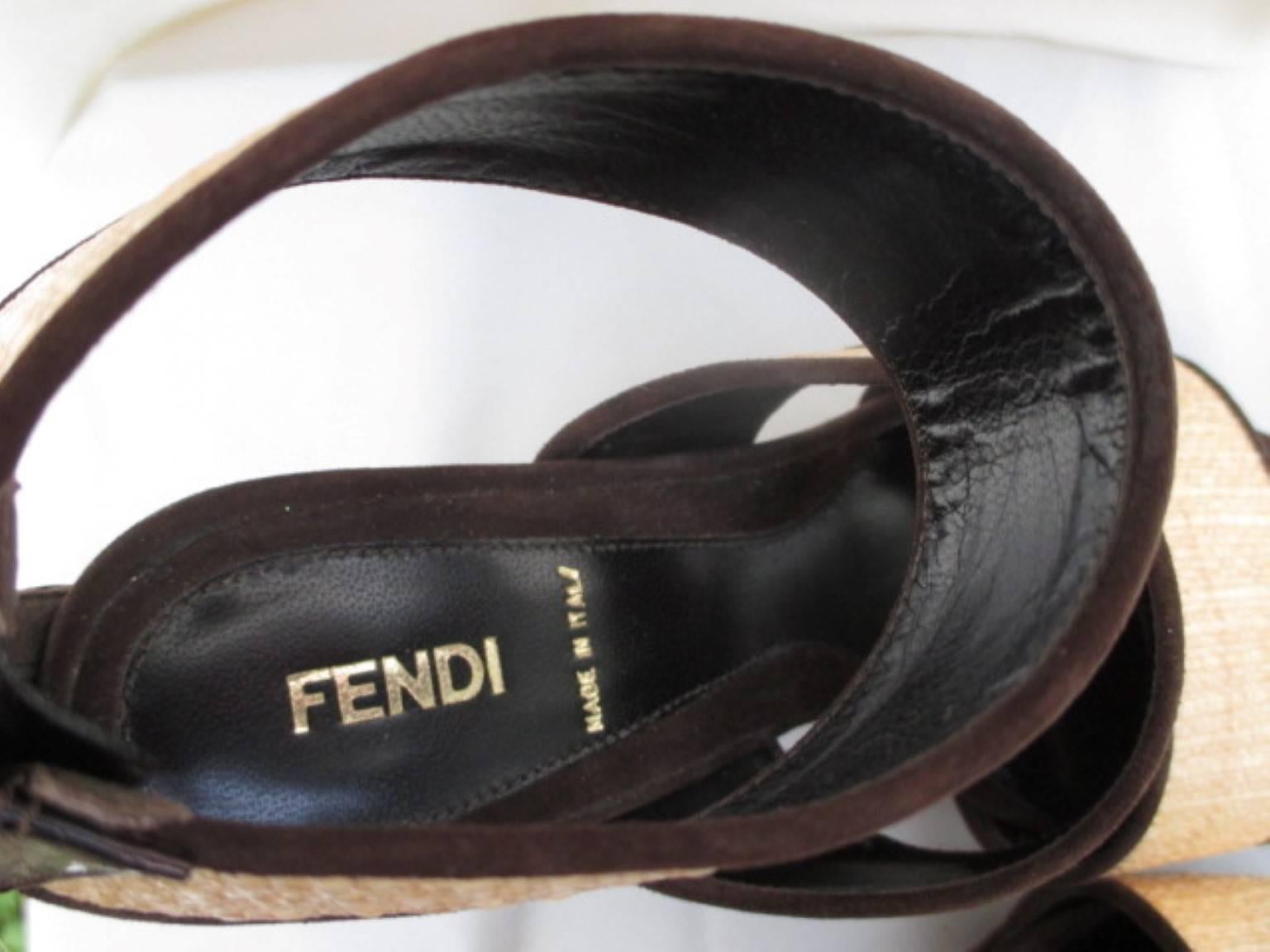 FENDI SHOES
Brown suede/ leather and wicker heels with zip at the ankle. No box.
In excellent condition. 
Patent heel.
Size:
EU 38
UK 5
US 7

Please note that vintage items are not new and therefore might have minor imperfections