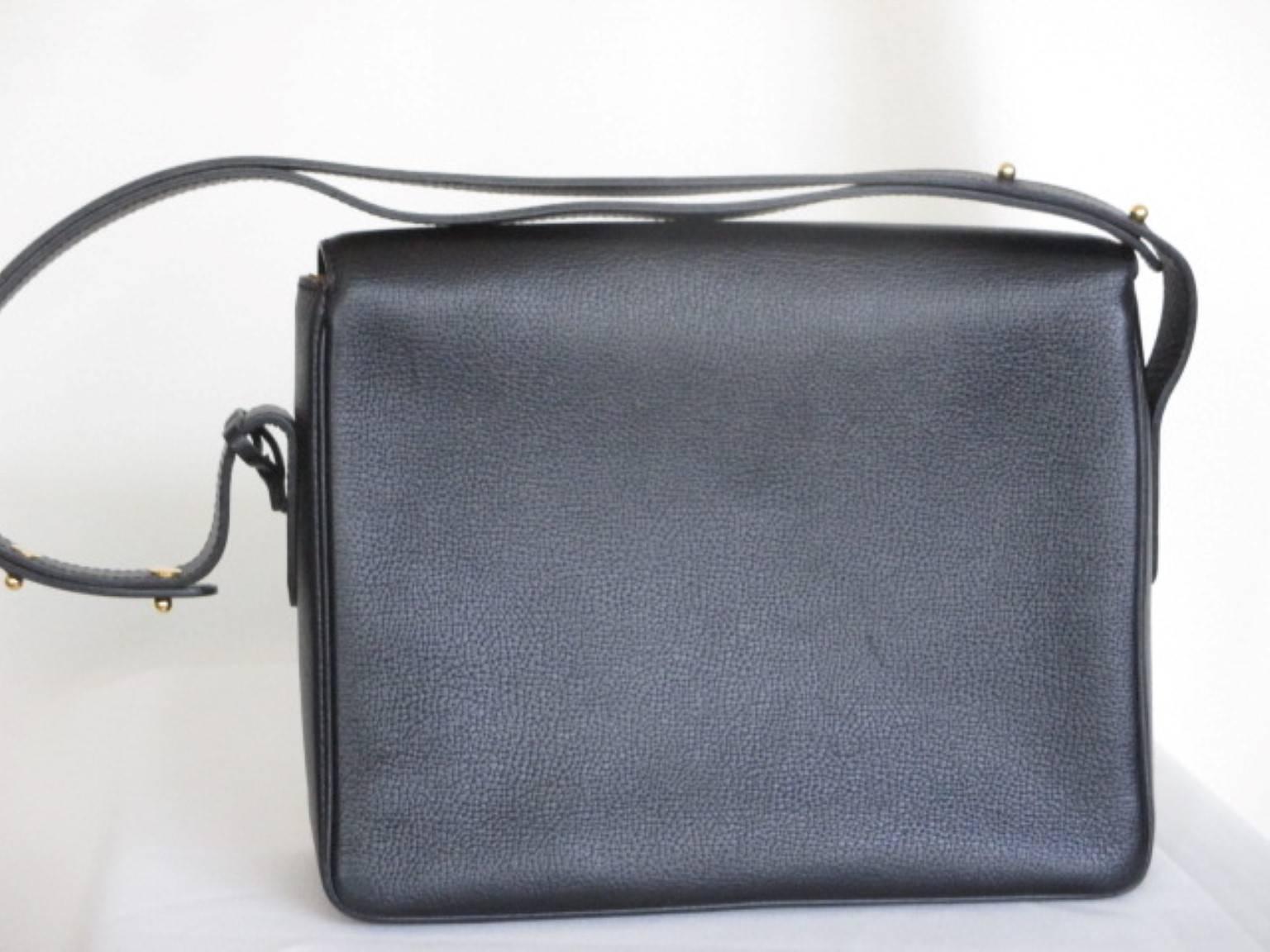 This black leather Delvaux bag is made in 1999,
model; poirier
Leather: Jumping
Comes with dustbag and Delvaux mirror.
Shoulderstrap is adjustable, can be worn as shoulderbag or handbag.
Fully lined in suede and a zipper pouch, 
closes with magnetic