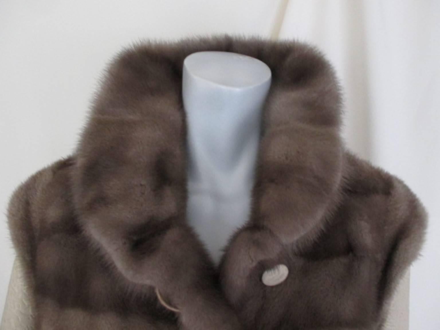 This coat is made of very soft quality blue iris mink and has printed leather sleeves and buttons.

We offer more luxurious fur items, view our frontstore.

Details:
Blue Iris Mink describes the darkest shade of the grey mink with pale underwool.