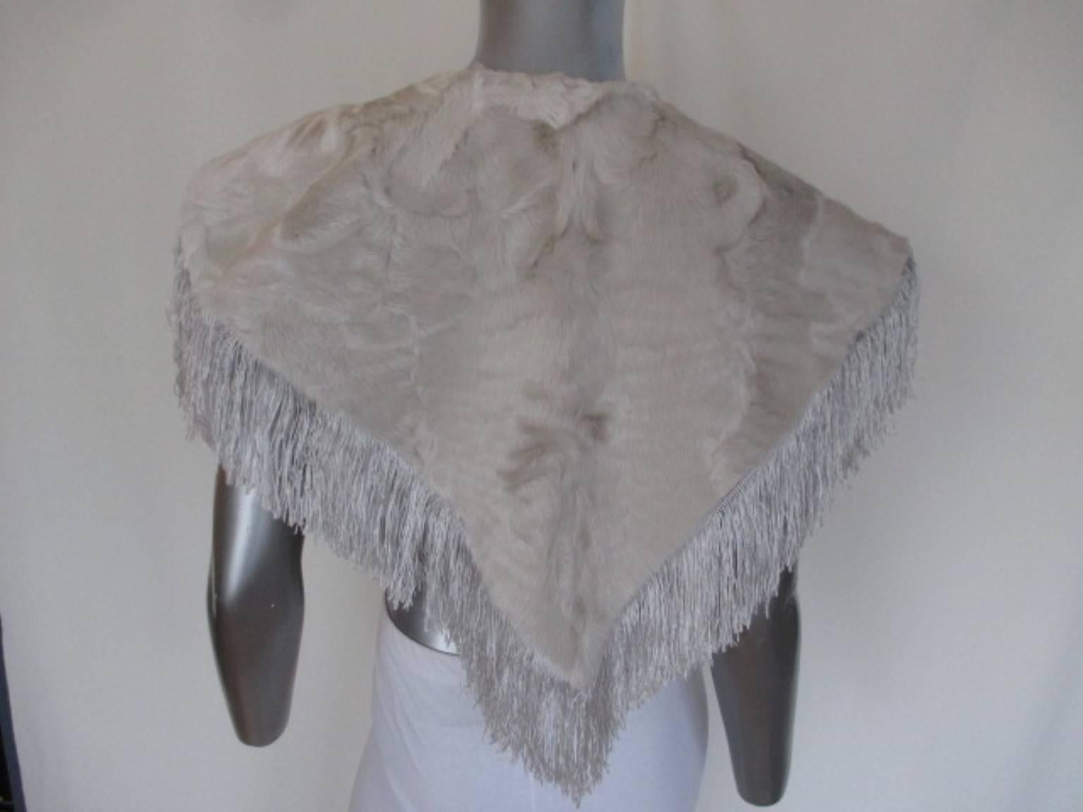 This beautiful vintage stole is made of beige color broadtail lamb fur.

We offer more vintage fur items, view our frontstore

Details:
In pre owned condition, with some minimum wear at the lining  (see picture)
Designed by Welmer Modelle,