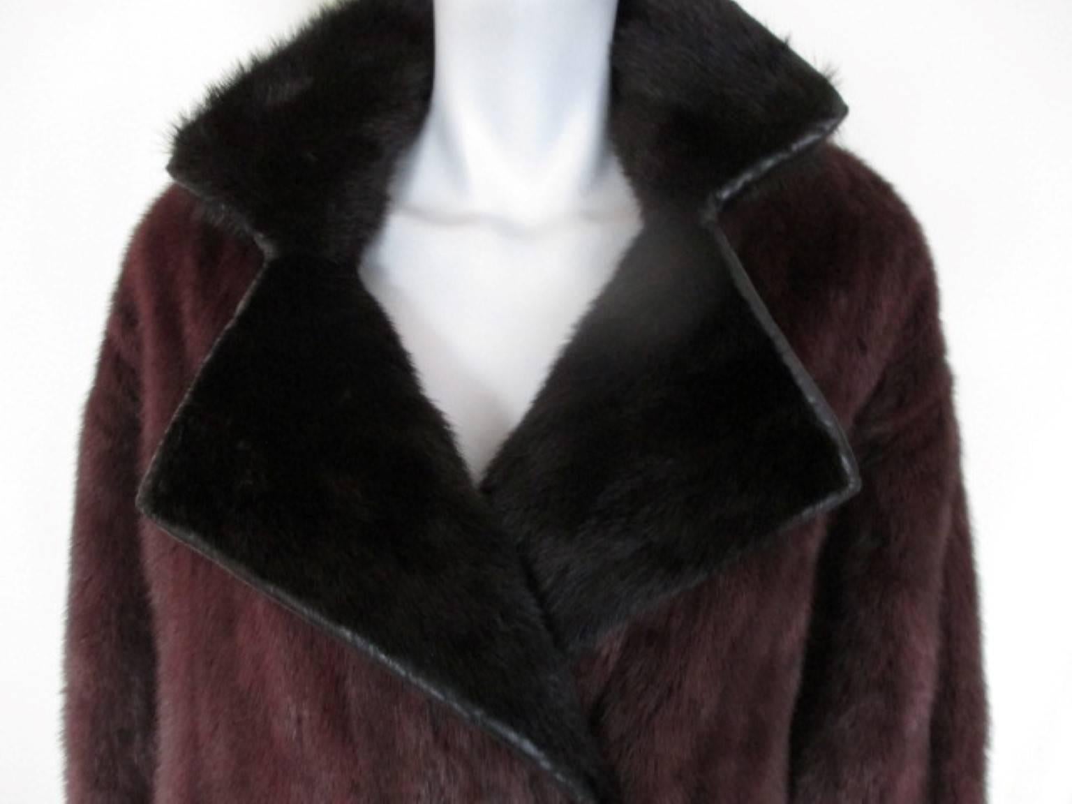 This vintage coat is made of dyed purple/black mink fur made by a furrier in Karlsruhe, Germany

We offer more exclusive vintage fur coats, view our frontstore
Details:
The sleeves and collar are trimmed with leather.
It has 2 pockets, 1 inside