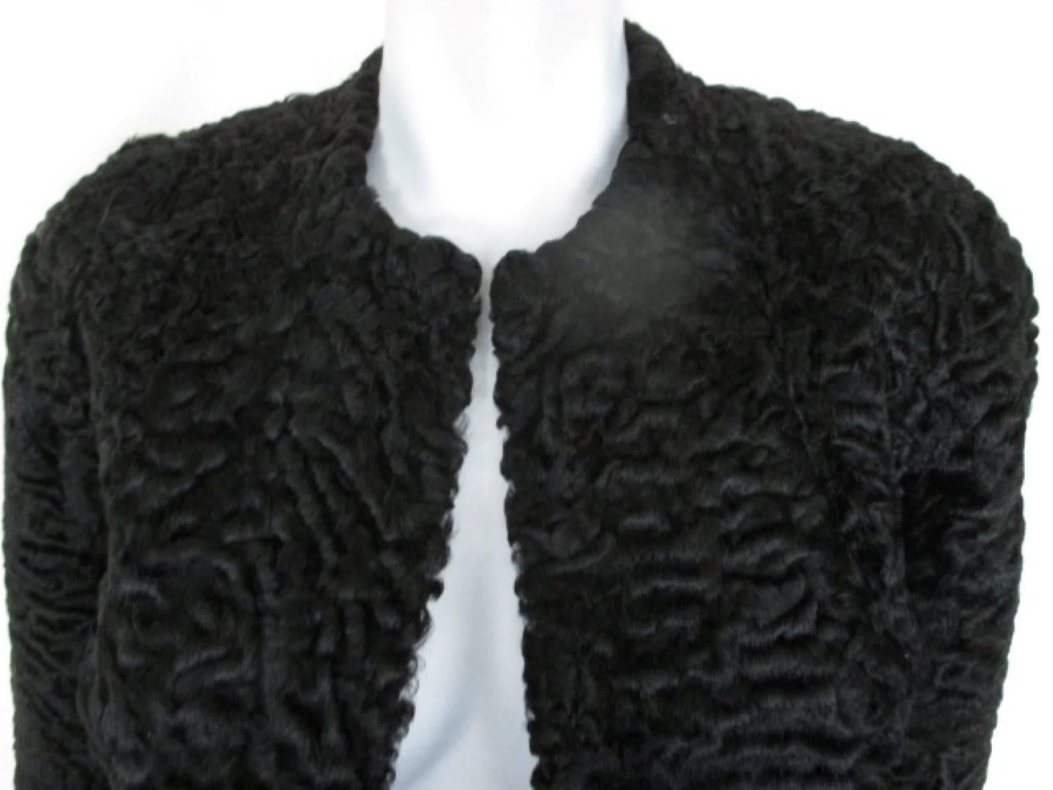This vintage jacket/bolero is made of black persian lamb 
Its in pre-loved condition and very light and easy to wear.
It has 3/4 sleeves
Size fits as small, see section measurements.
Please note that vintage items are not new and therefore might