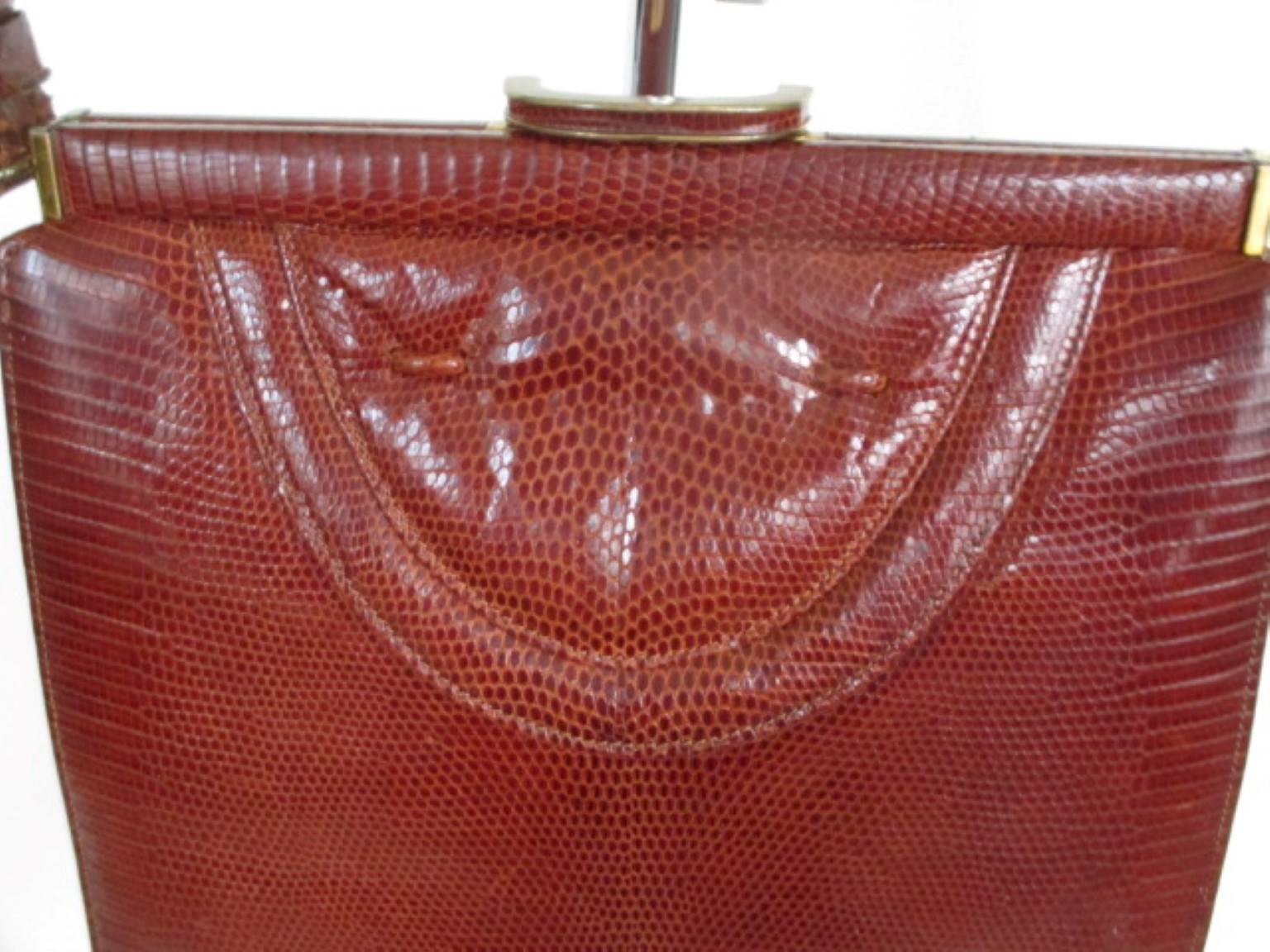 vintage Lizard bag -collectors item-
orange brown color
Gold hardware
Inside is made of soft suède leather with pockets
Condition is fair with minor wear at the gold hardware, handles and leather.
Measurements:
H 23 cm x 22 cm x 8 cm
9.05 inch x