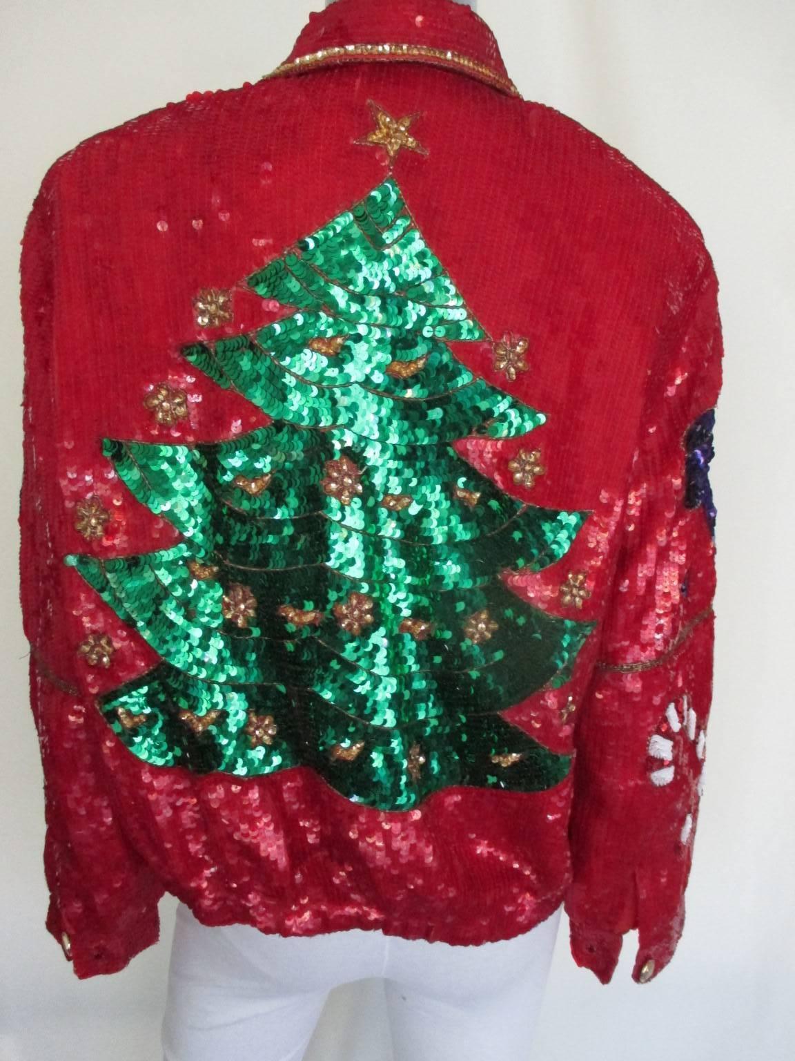 This vintage jacket is made of all-over sequins with descriptions Xmas items.

We offer more sequin vintage items, view our frontstore
Details;
With 6 presbuttons , 2 pockets and is elasticized at hem and fully lined.
Size fits like a small to