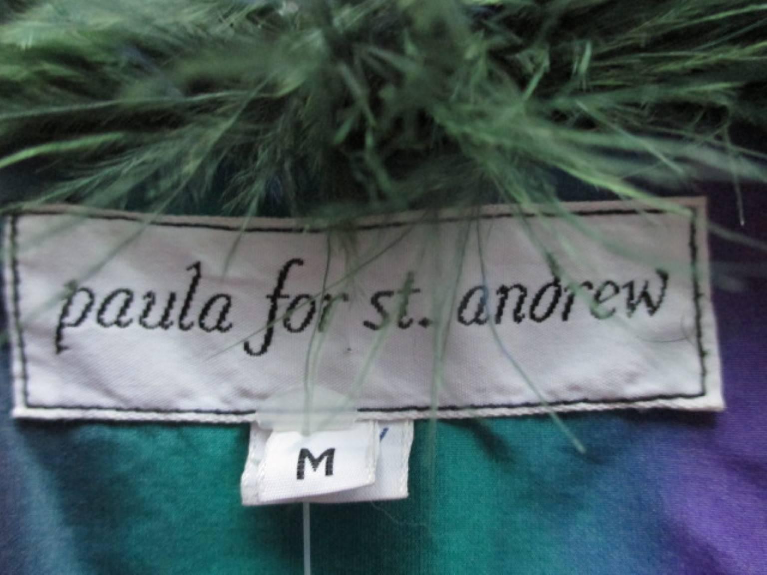 This vintage coat is with rainbow stripes and a rainbow lining from Paula for st. Andrews.
The coat is very light to wear and like all feather coats its very delicate and has condition issues.

Its very theatrical/stage piece and a collectors