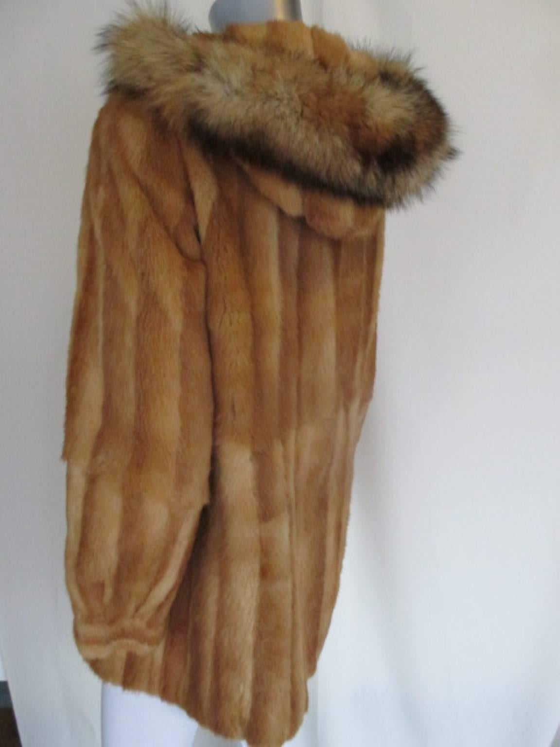 Women's exclusive hooded fur coat with fox ruff 