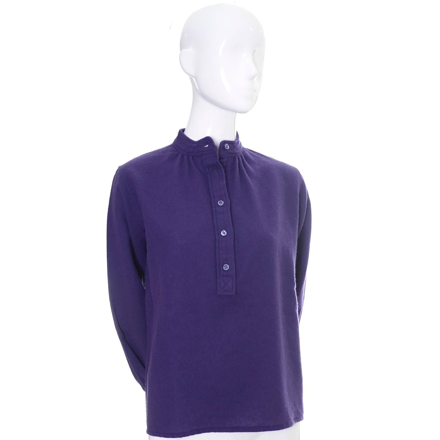 This vintage 100% wool purple peasant top is from the 1970's and has the Yves Saint Laurent Rive Gauche label.  This blouse has a mandarin collar and buttons halfway up the front.  The label indicates it is a size 36 and it is in excellent