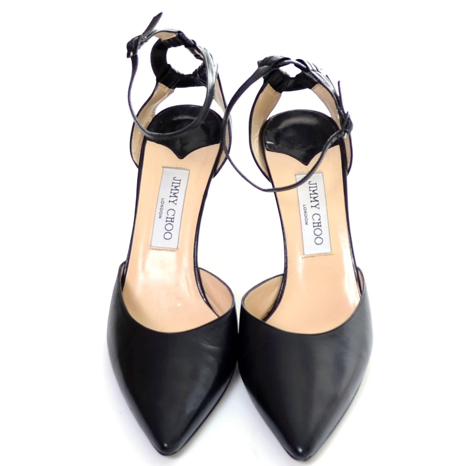 These Jimmy Choo black leather ankle strap shoes have 4