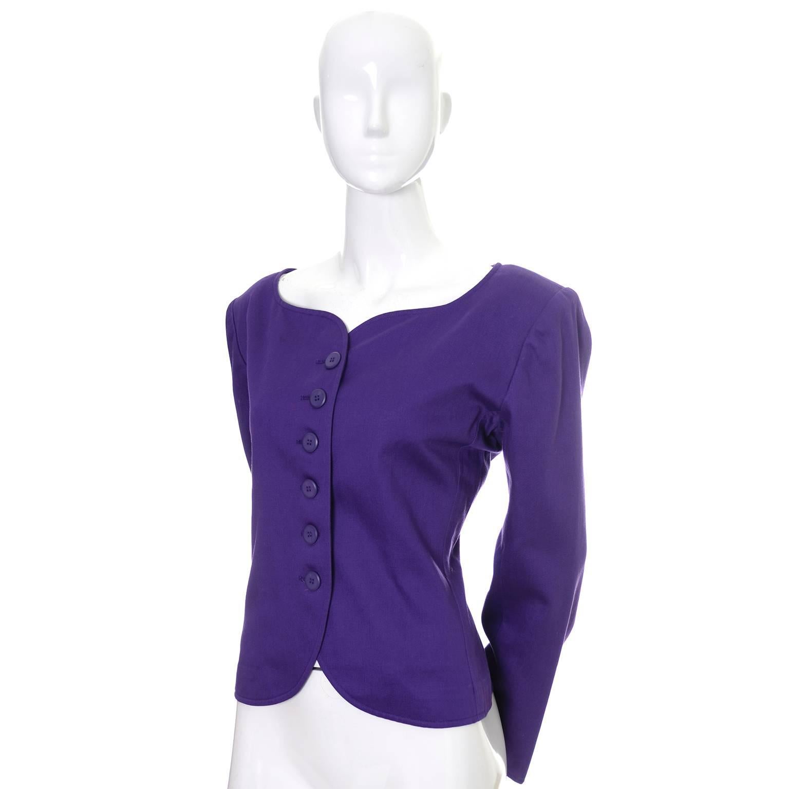 This is a great blazer from Yves Saint Laurent from the early 1980's in excellent condition. This purple cotton jacket has shoulder pads and a scalloped neckline.  This size 40 jacket has the YSL Rive Gauche label and was made in France. This is