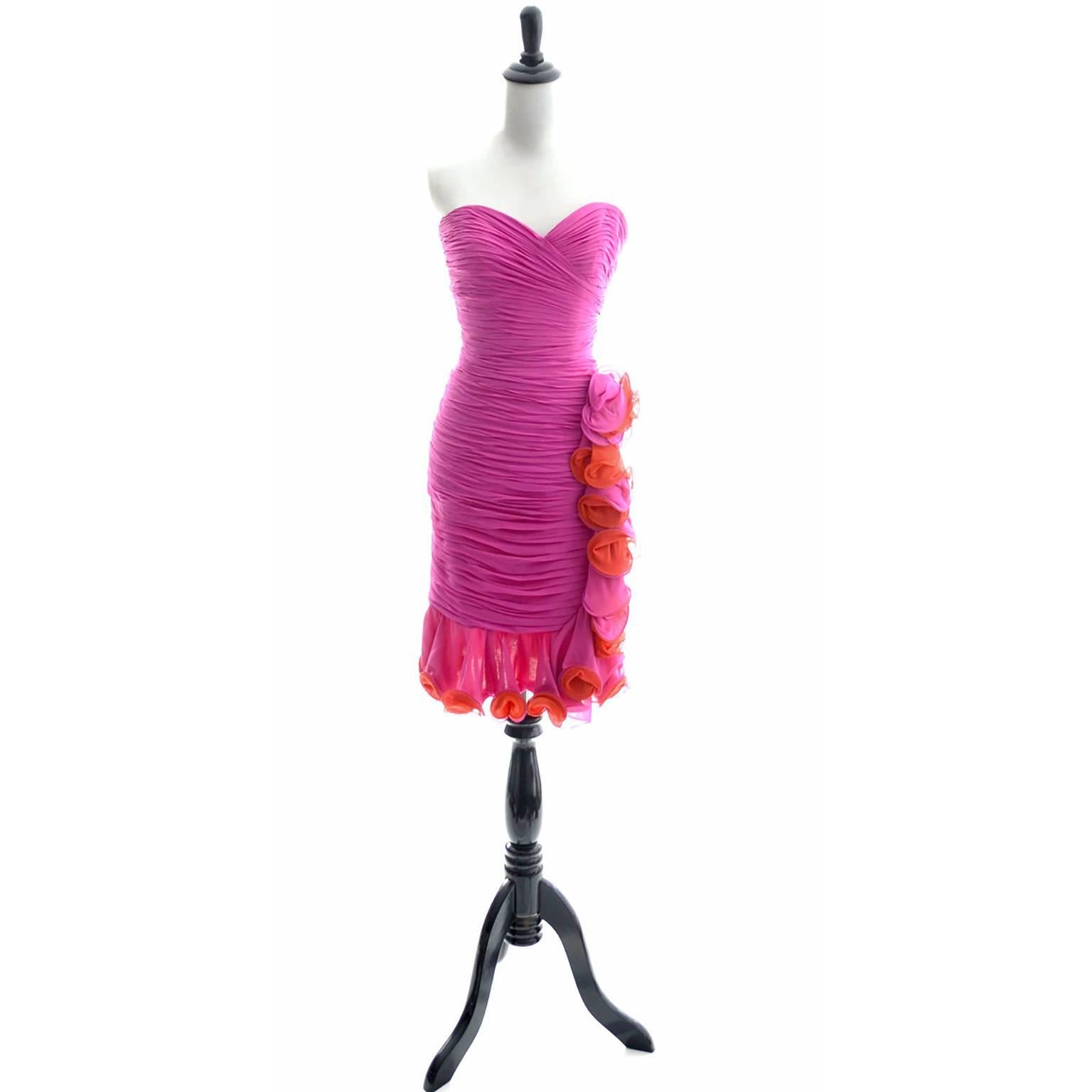 This is a fabulous vintage dress from the 1980's by A.J. Bari! The fit of this micro pleated wiggle dress is sublime with the heart shaped bust line and the curve hugging shape. I also love the colors - bright pink and orange, and the pretty loopy