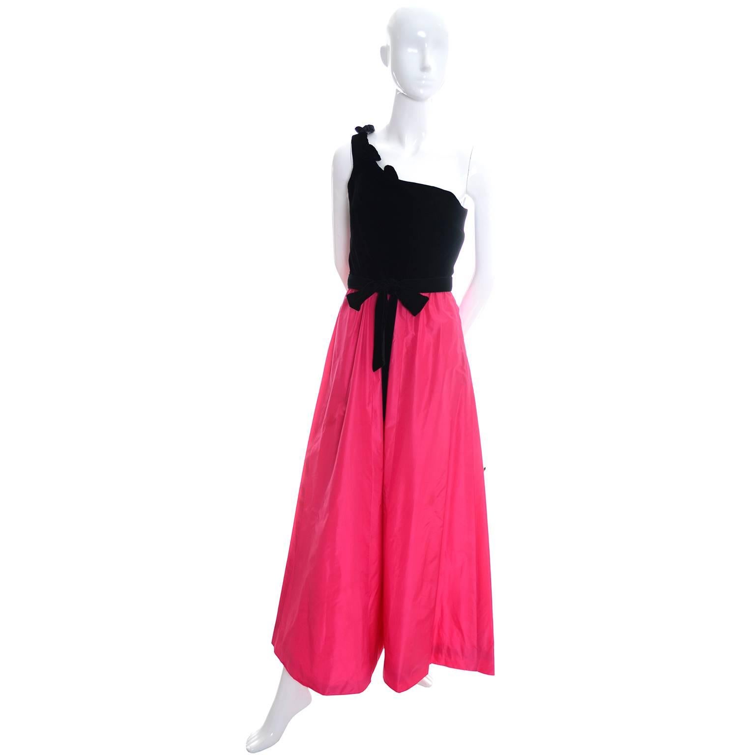 This pretty late 1980's one shoulder vintage dress is from Eugene Alexander of Sarasota Florida.  The bodice of the dress is black velvet with pretty velvet leaves along the shoulder and the skirt is a beautiful pink taffeta satin.  There is a side