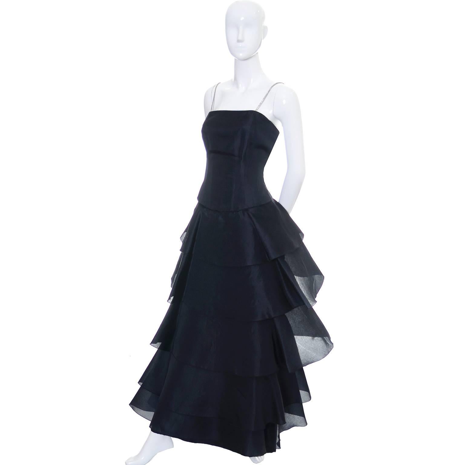 This dramatic black, full length 100% silk statement dress was designed by Akira Isogawa, one of Australia’s most important designers. Isogawa was born in Kyoto Japan and moved to Australia in 1986 to study fashion design at the Sydney Institute of