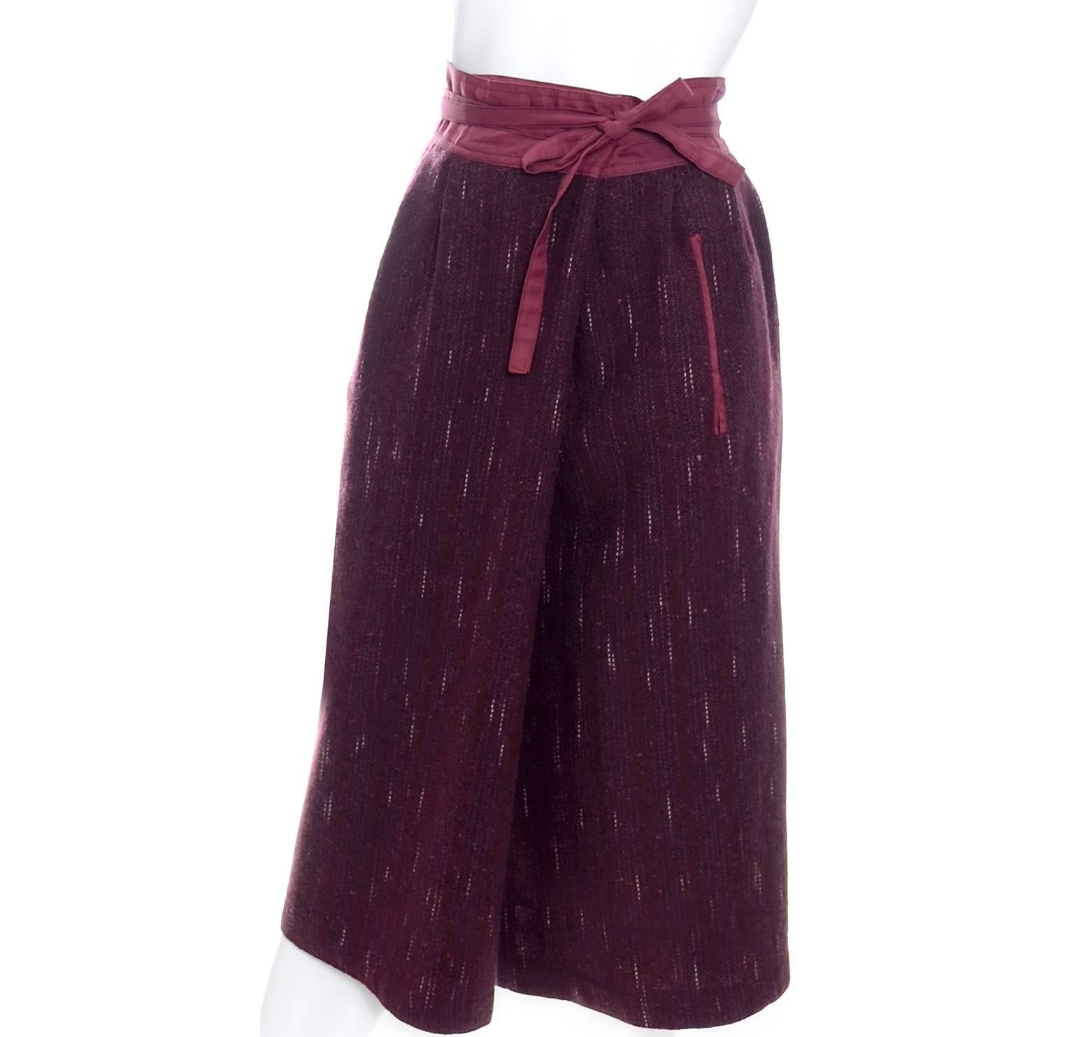 This is a fantastic vintage skirt from Kenzo.  This vintage burgundy red tweed wool skirt is lined and has an unusual fold over wrap style design that closes with a tie at the waist.  Though not a classic 