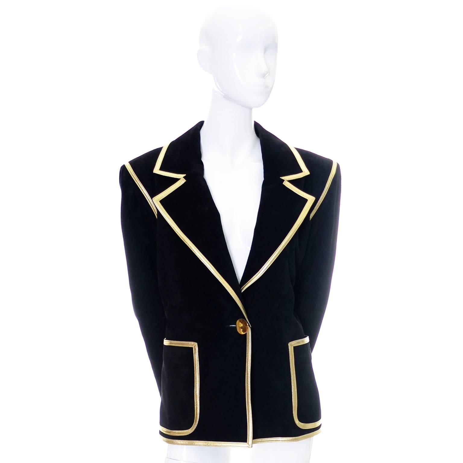 This is an outstanding vintage jacket from Yves Saint Laurent. This as new vintage blazer is fully lined and is made of a luxe black calf suede and trimmed in metallic gold leather.  This coat has the Saint Laurent Rive Gauche Label and was made in