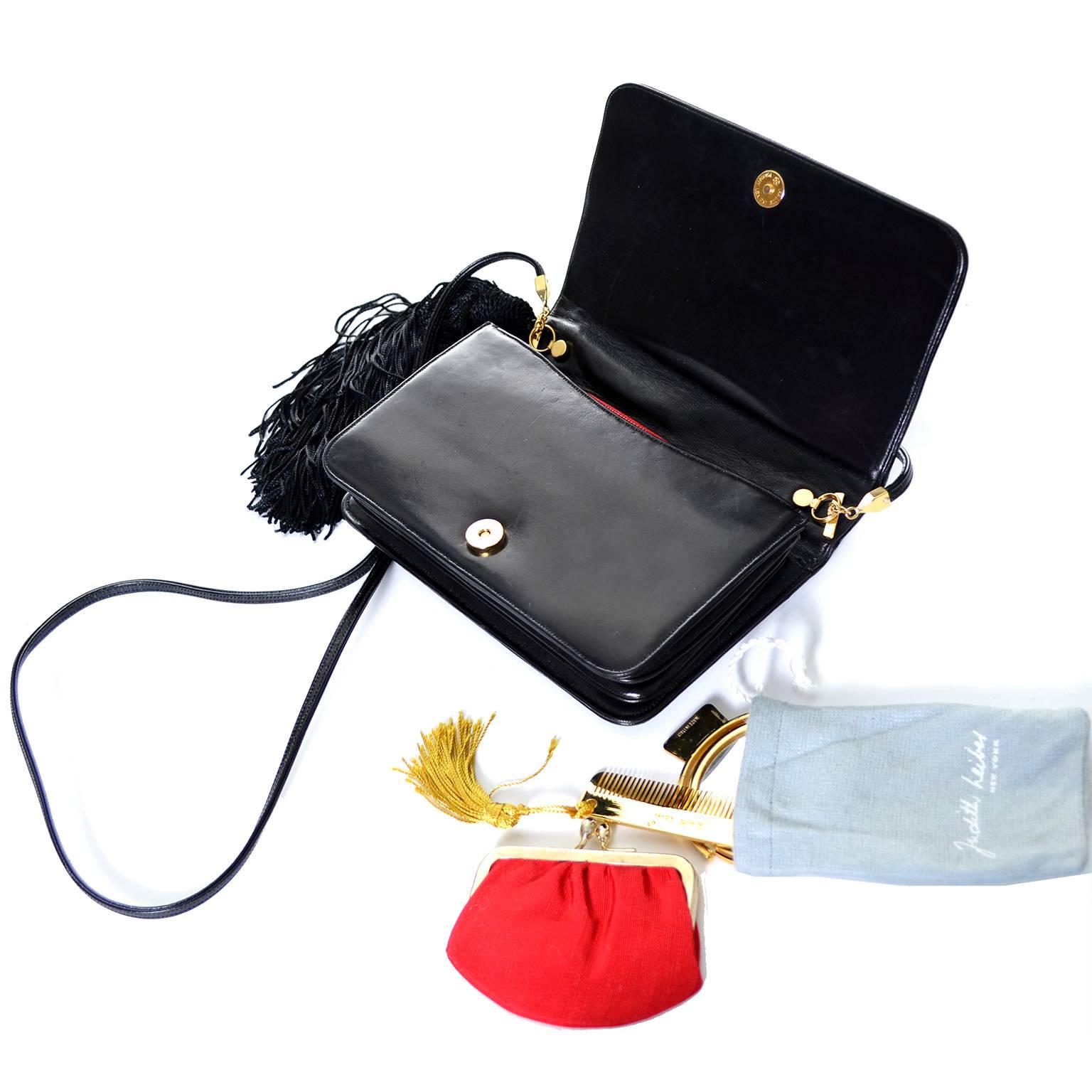 This is a vintage black patent leather Judith Leiber handbag with a side tassel and 6 brass animals and colored stones on the front.  You can carry this bag as a clutch or a shoulder bag. The bag has a detachable shoulder strap with a 19