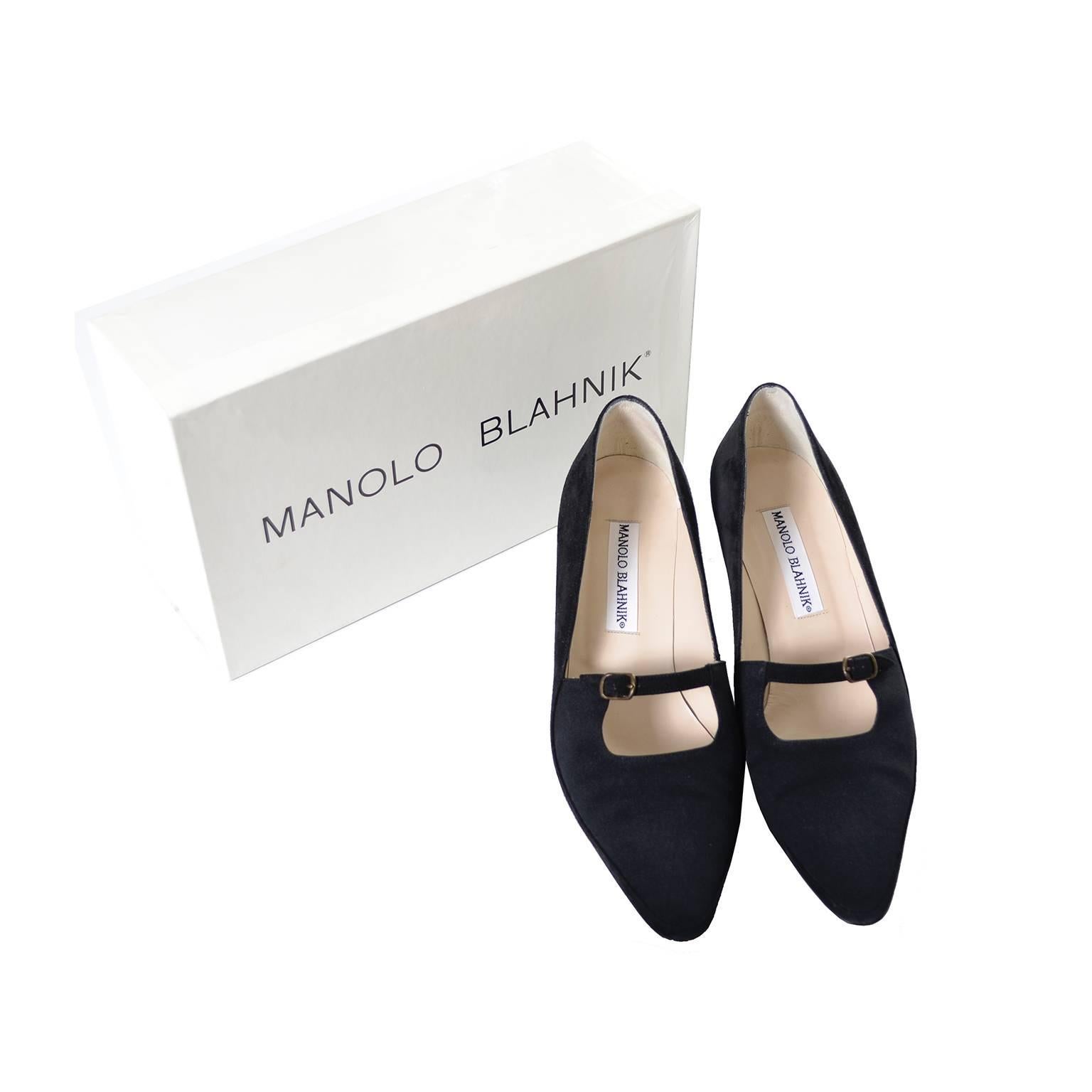 These black suede Manolo Blahnik shoes were only worn once and come with their original box.  These Mary Jane style heels are labeled a size 7.5 and were made in Italy.  They are 3 inches wide at the outside of the sole and have 2 inch kitten heels.