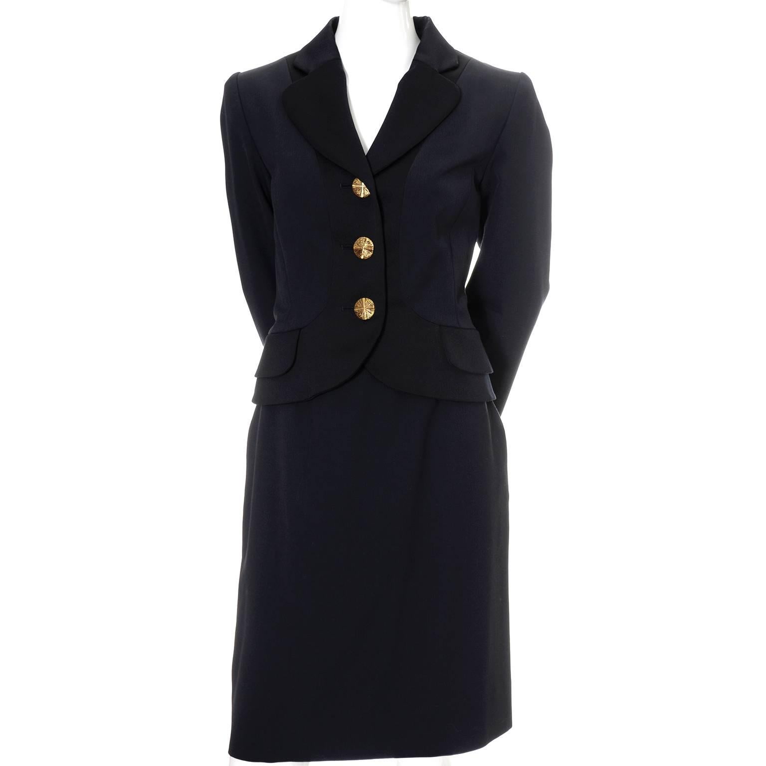 This gorgeous YSL vintage 2 piece skirt and blazer suit is made of a finely ribbed midnight blue wool crepe with black satin trim.  This Yves Saint Laurent Rive Gauche suit was made in the 1990's in France and is in as new condition.  The lined