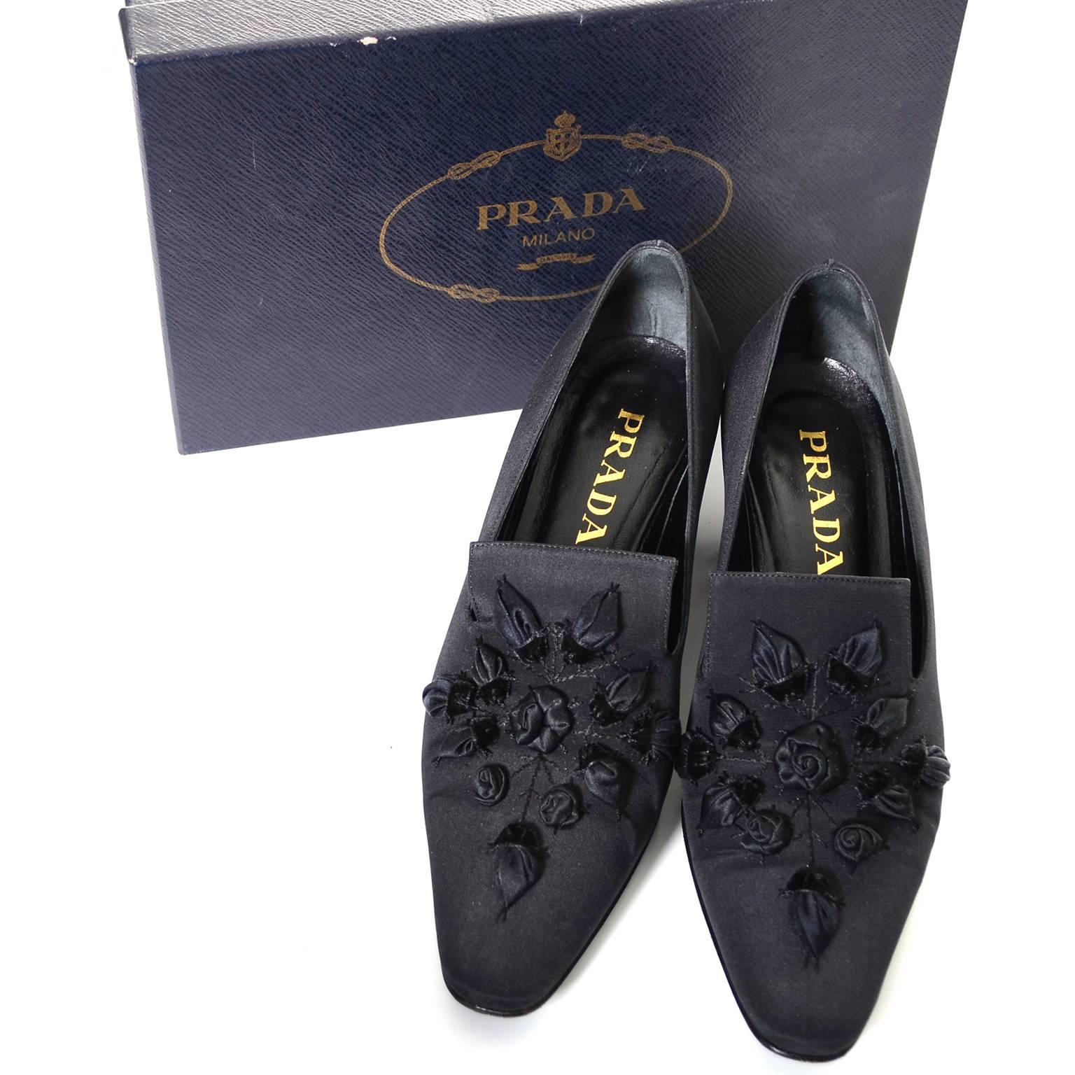 These vintage black Prada heels have beautiful roses and come with their original box.  They are a size 37.5 or US size 7 and have 2 and 1/4" heels.  These great vintage shoes measure 3.5" at the widest part of the outside of the soles and