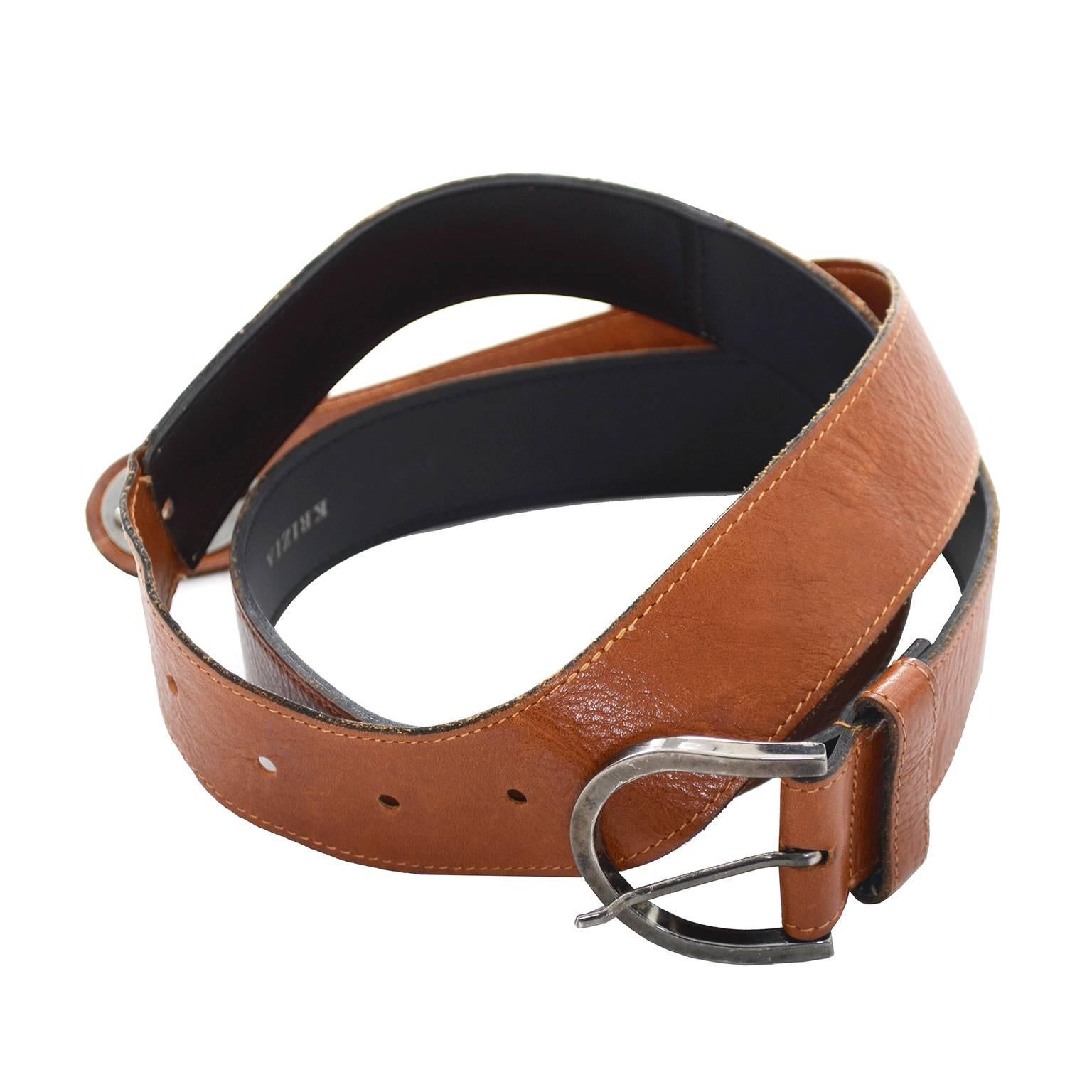 We ove this Krizia vintage leather belt! This fabulous belt is shaped somewhat like an L and can be looped over as shown in the photographs.  The belt is 1 and 1/2 inches wide and fits from 31-35
