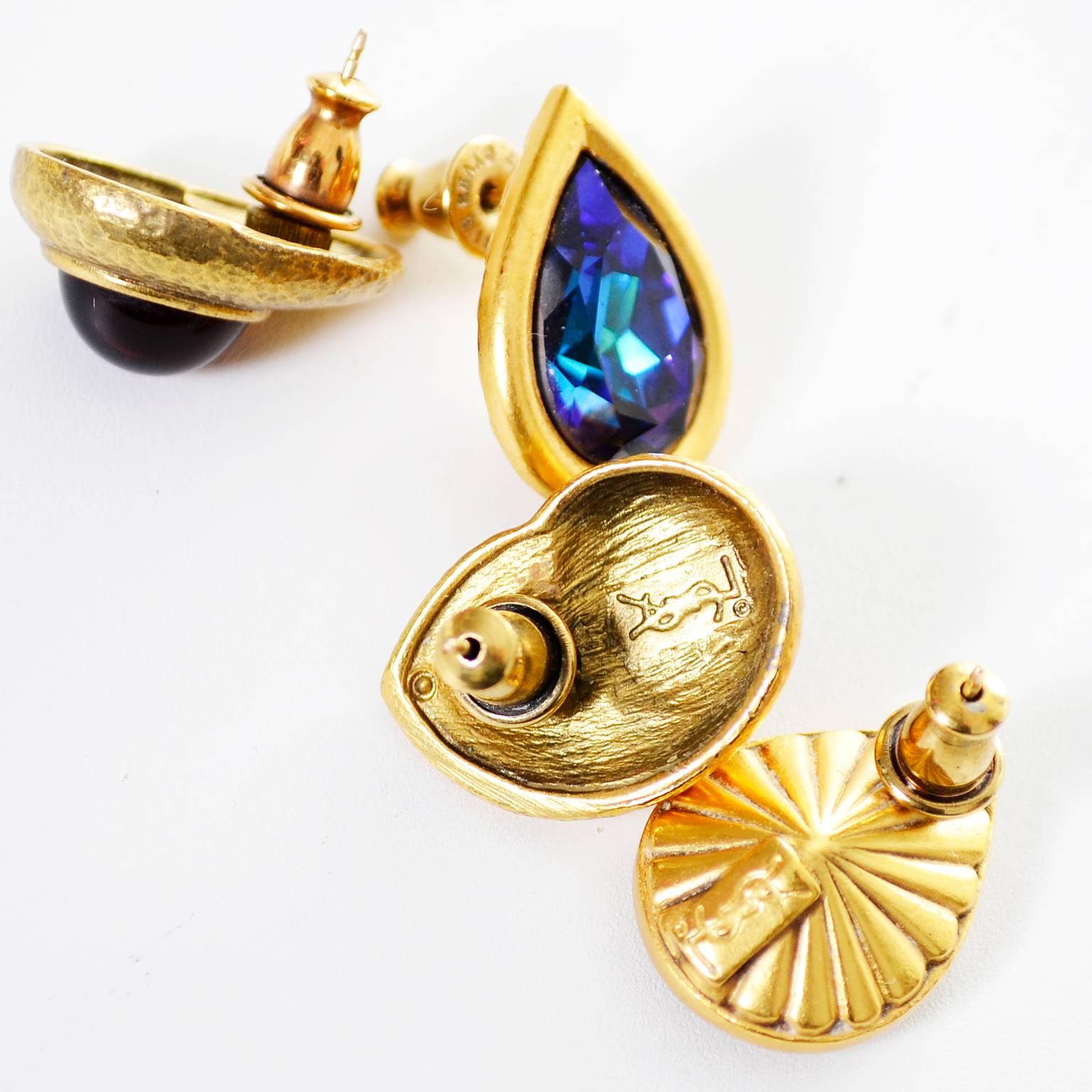 I love these YSL vintage pierced earrings! Both of these pair of earrings are 3/4 inches long and they are both signed.  The first pair is a made of a gold textured metal with deep red stones and the other is a teardrop shaped pair with blue faceted