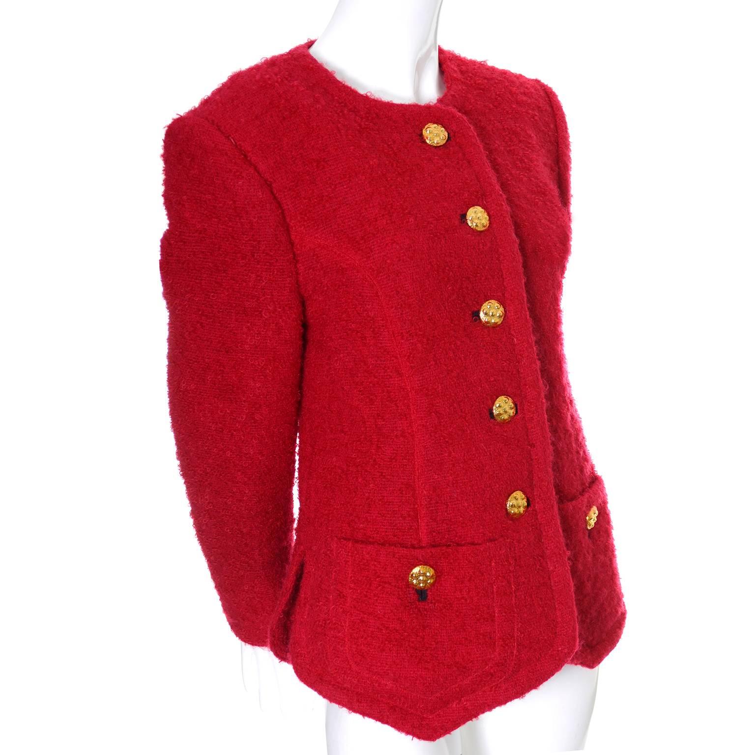 This vintage red boucle wool blazer was designed by Yves Saint Laurent in the late 1980's or early 1990s. The jacket is fully lined and has beautiful buttons and front pockets.  This piece comes from a collection of YSL vintage clothing that I