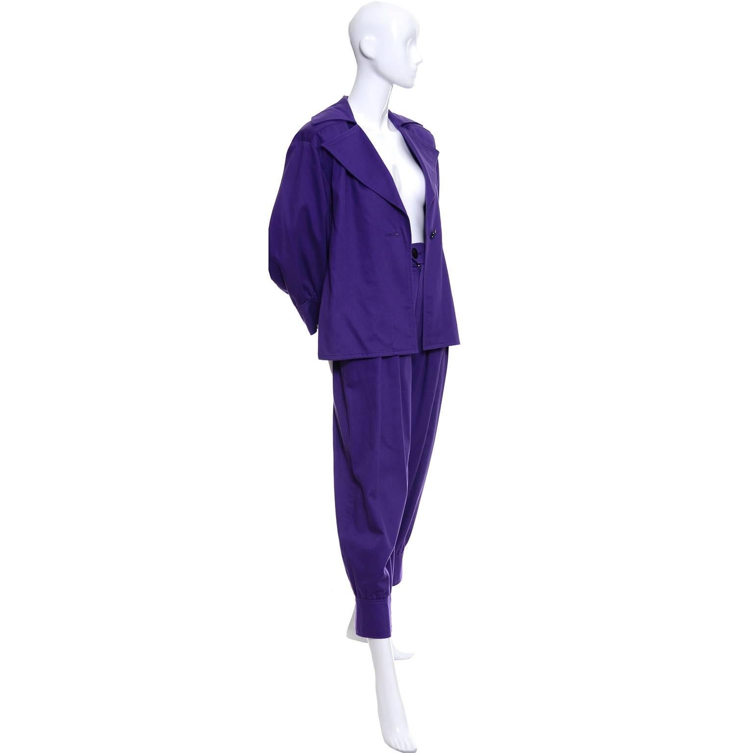 This is a fabulous purple cotton 2 piece vintage outfit from YSL with a puffy long slightly off shoulder peasant sleeves jacket/top, and a pair of knickerbocker style pants.  The pants have side slit pockets and a front zipper, and the jacket has a