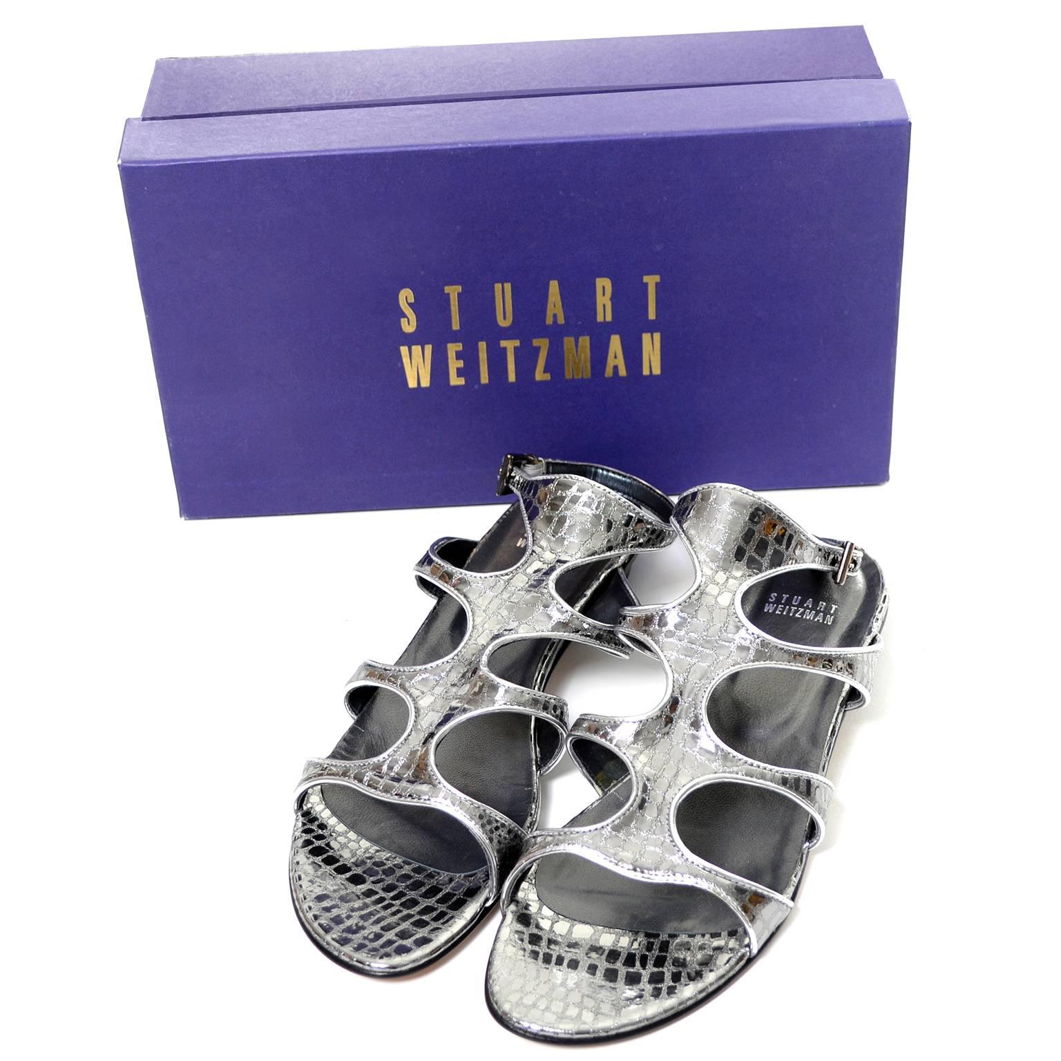 These gladiator metallic steel mini gator embossed leather Stuart Weitzman sandals are new and come in their original box.  The shoes have a 1/2