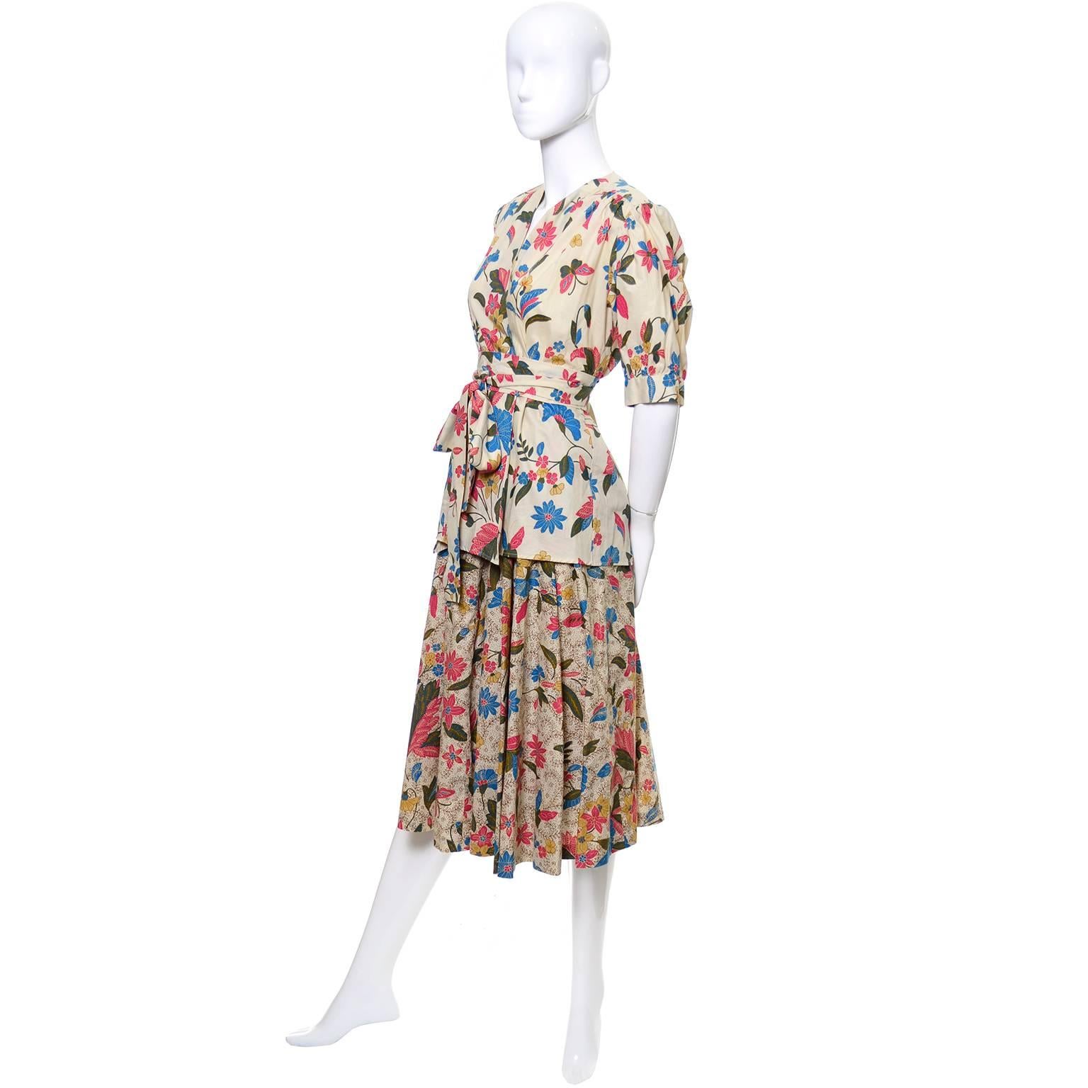 This vintage 2 piece peasant day dress outfit from Yves Saint Laurent is from one of our more memorable estates of vintage clothing and accessories. This is an incredible outfit with a full skirt and a button front blouse or jacket that can be worn