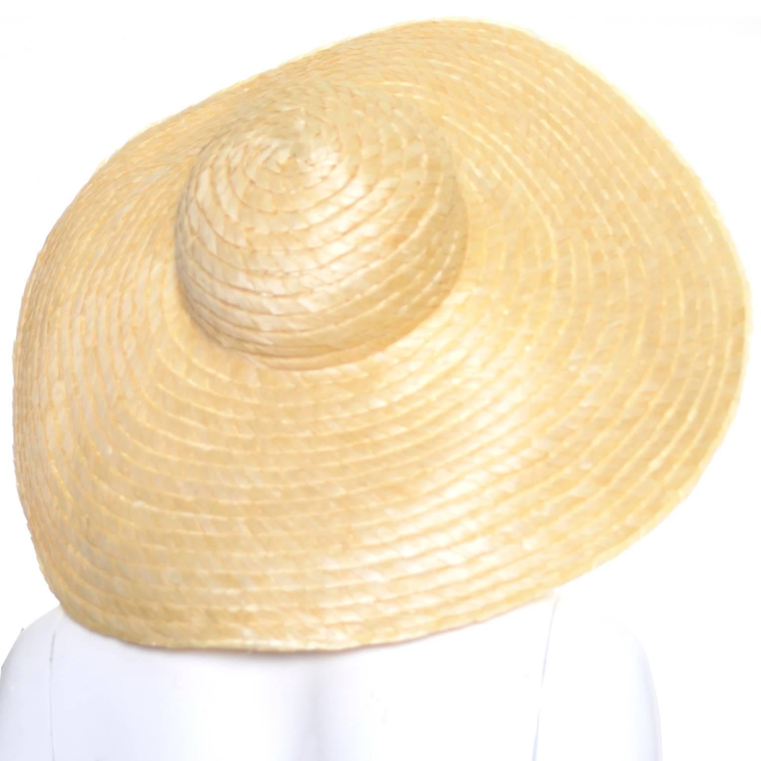 This is a gorgeous wide brim floppy straw hat from I Magnin.  This hat is from the 1940's and is in exceptional condition.  The hat has a 6