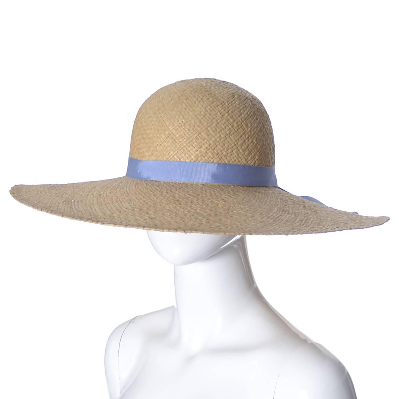 This is a classic late 1970's wide brimmed vintage straw hat from Ralph Lauren.  This natural straw vintage hat has a pretty sky blue grosgrain ribbon and a wide 5 and 1/2 inch brim.  This hat came from an estate of quite a few beautiful Ralph