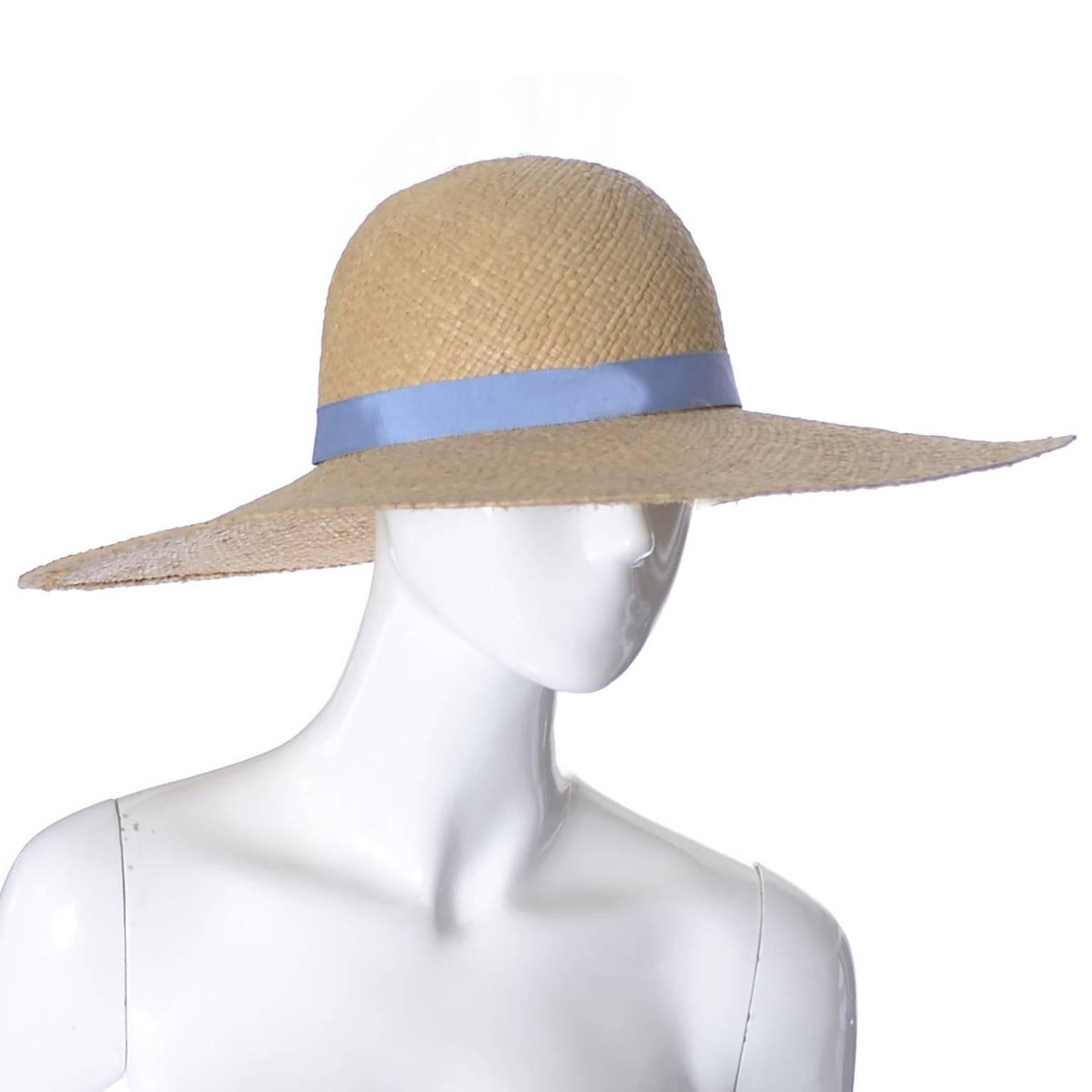 straw hat with blue ribbon