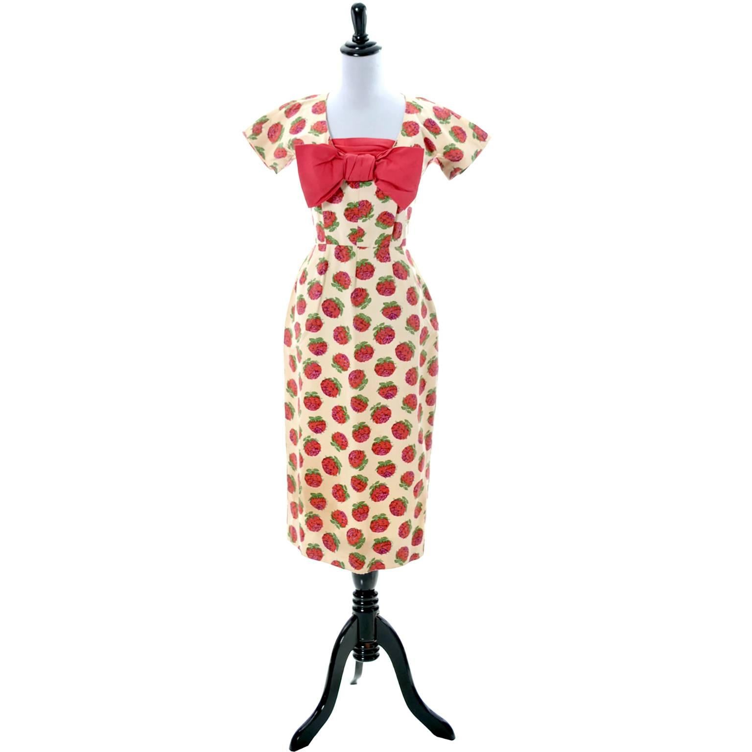 This is an exceptionally well designed 2 piece dress from Christian Dior. This 1950's Dior dress has a red bow and a detachable shawl 