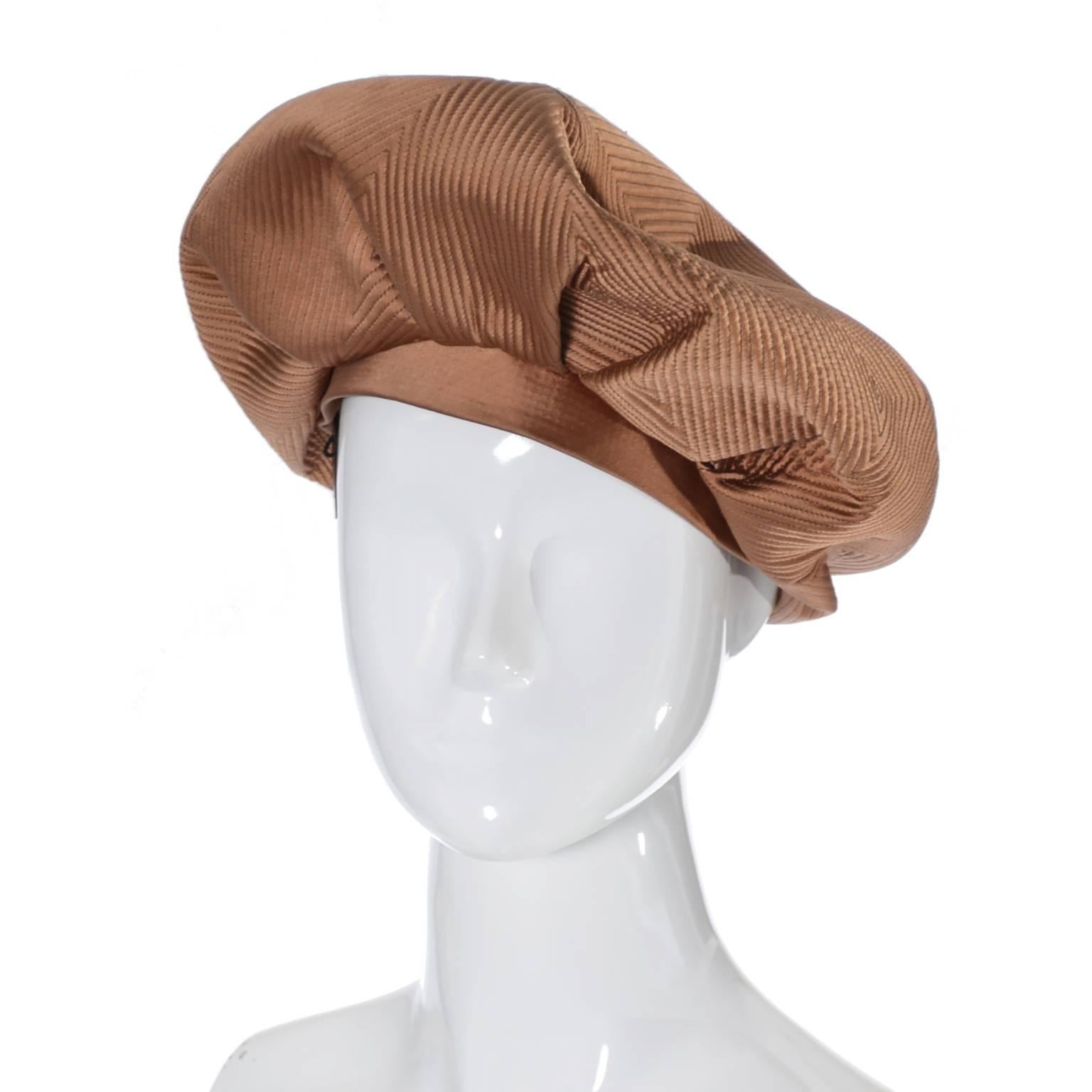 This is a beautiful copper satin vintage hat from the 1960's by John Frederics. This top stitched beret is in excellent condition and is from the late 60's and was made in America. This beautiful hat is in excellent condition and can be worn in many