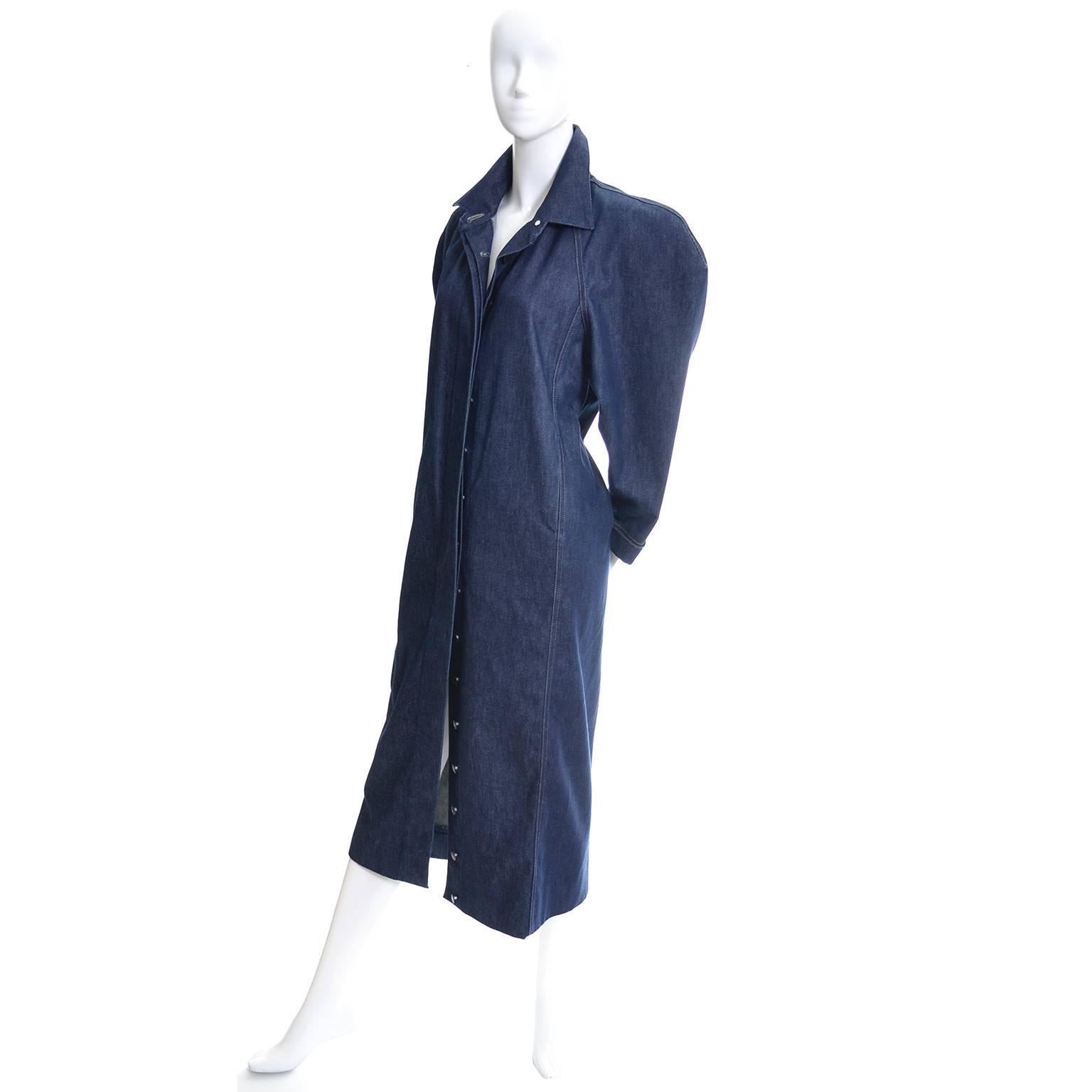 This fabulous vintage dress was designed by Norma Kamali in the 1980's and was purchased at the high end Portland, Oregon boutique "Mario's".  The dress is in a luxe denim and buttons up the front with brass buttons.  The classic Norma
