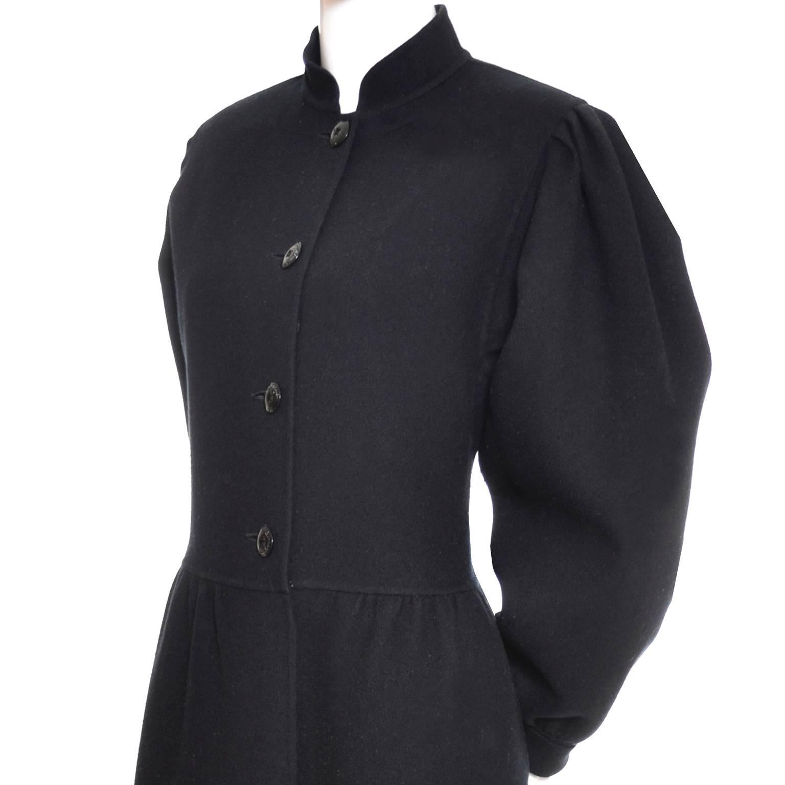 This is a wonderful vintage black wool coat dress from Salvatore Ferragamo.  This could be worn as a coat if you don't mind slipping it over your head.  I love the mandarin collar, and it is unlined with side pockets and great gathered sleeves. 