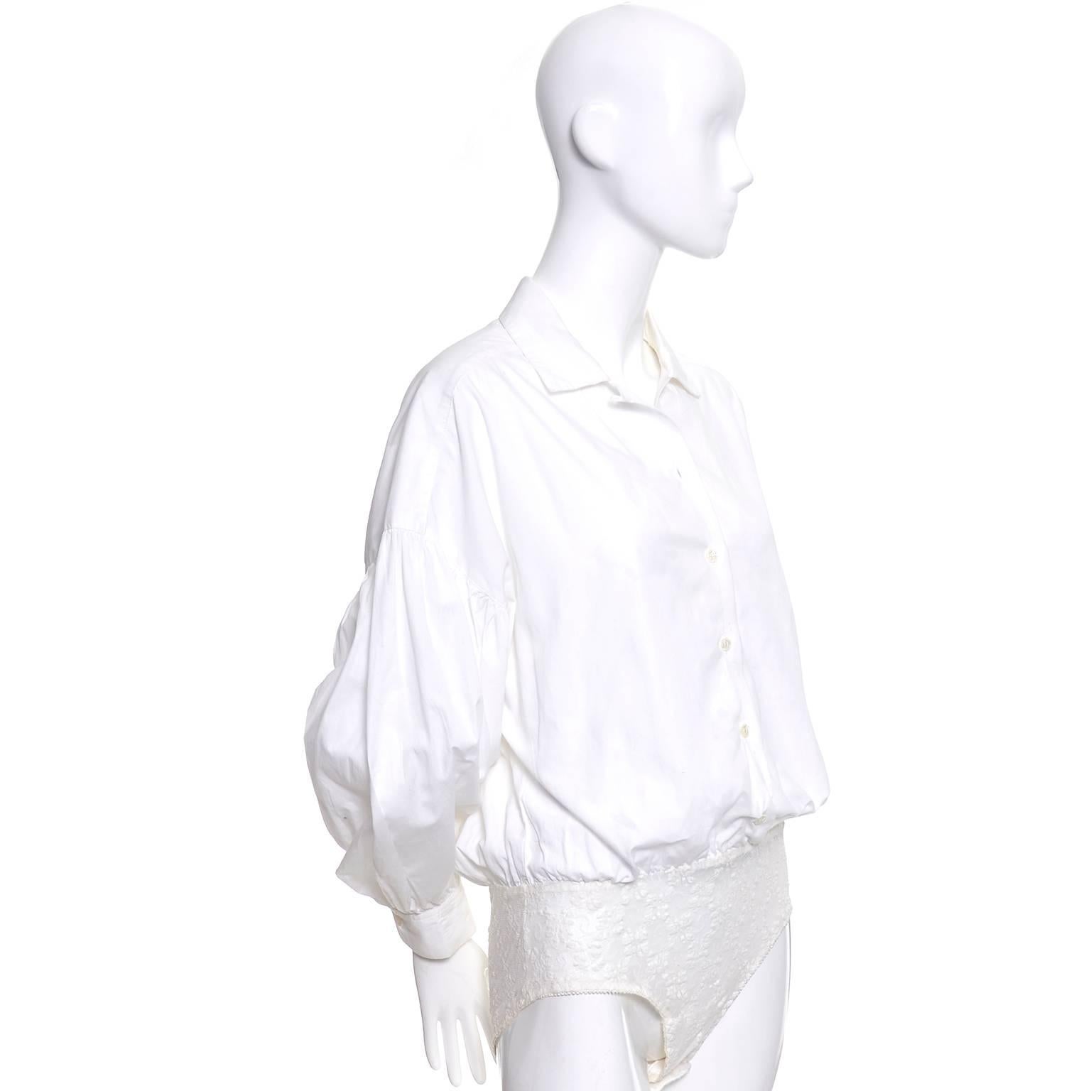 This is a fab vintage white cotton blouse from the 1980s from Christian Dior.  The blouse is a bodysuit with a stretch lace bottom that snaps and the puff sleeves are gathered at the drop shoulder line. These blouses were so popular in the 80's and