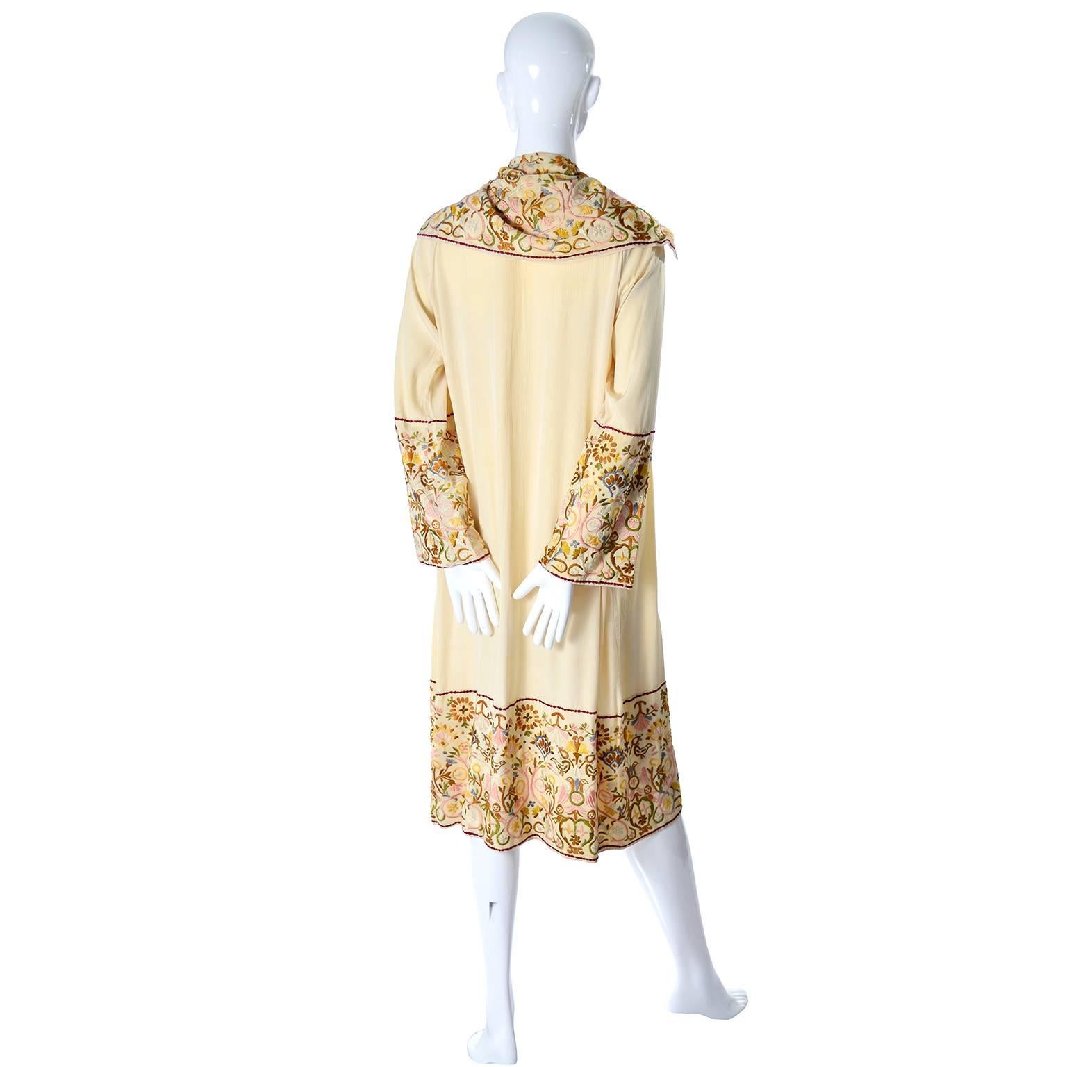This gorgeous late teens or early 1920's vintage silk robe comes from an estate of antique Asian textiles and clothing I handled a while back.  This has the feel of an art deco kimono without the large sleeves and you could wear it as an evening