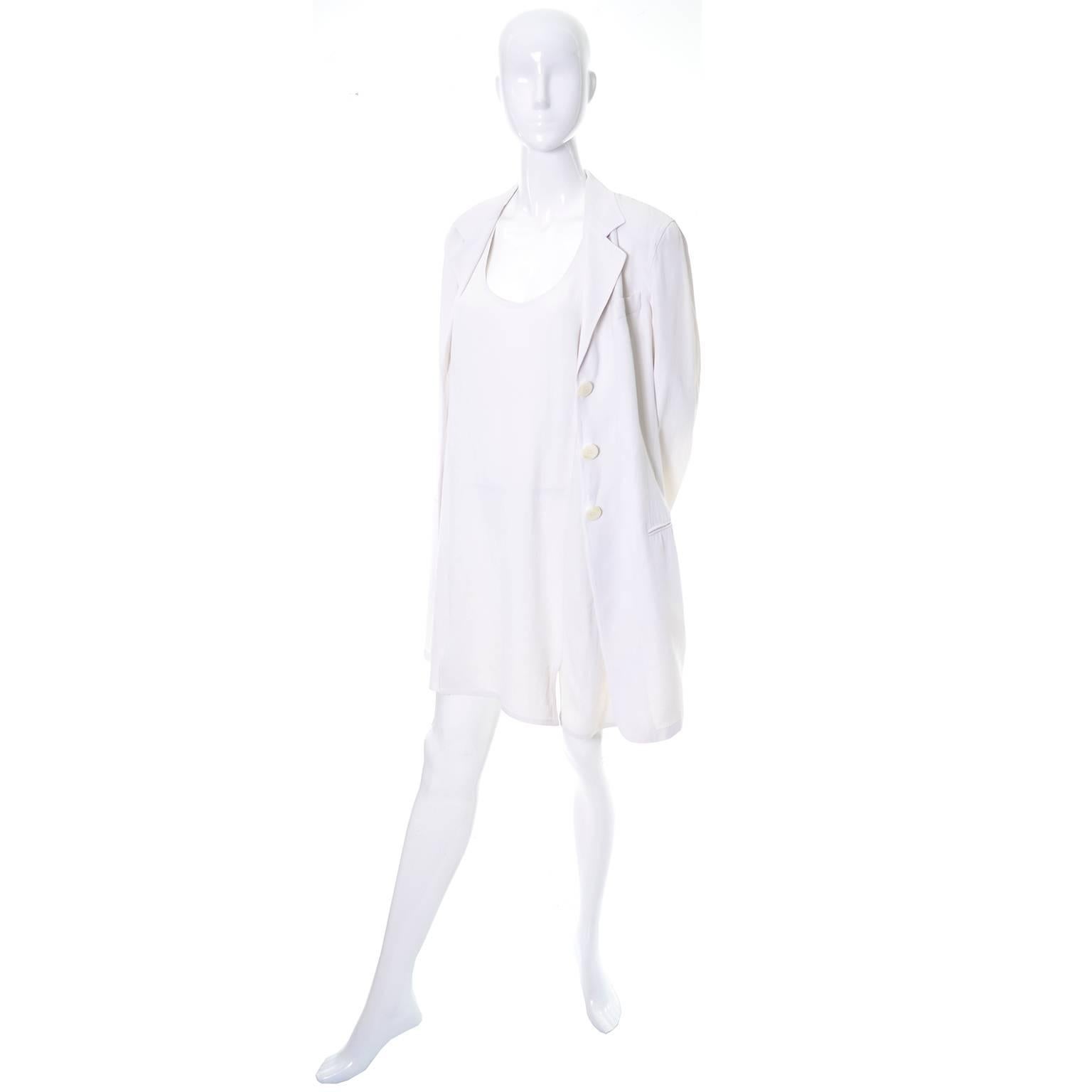 This pretty 2 piece vintage outfit was designed by Donna Karan and made in Italy in the 1990's.  This includes a racer back shift dress with a small slit and a long single breasted coat with front pockets.  The fabric is an ivory/white acetate linen