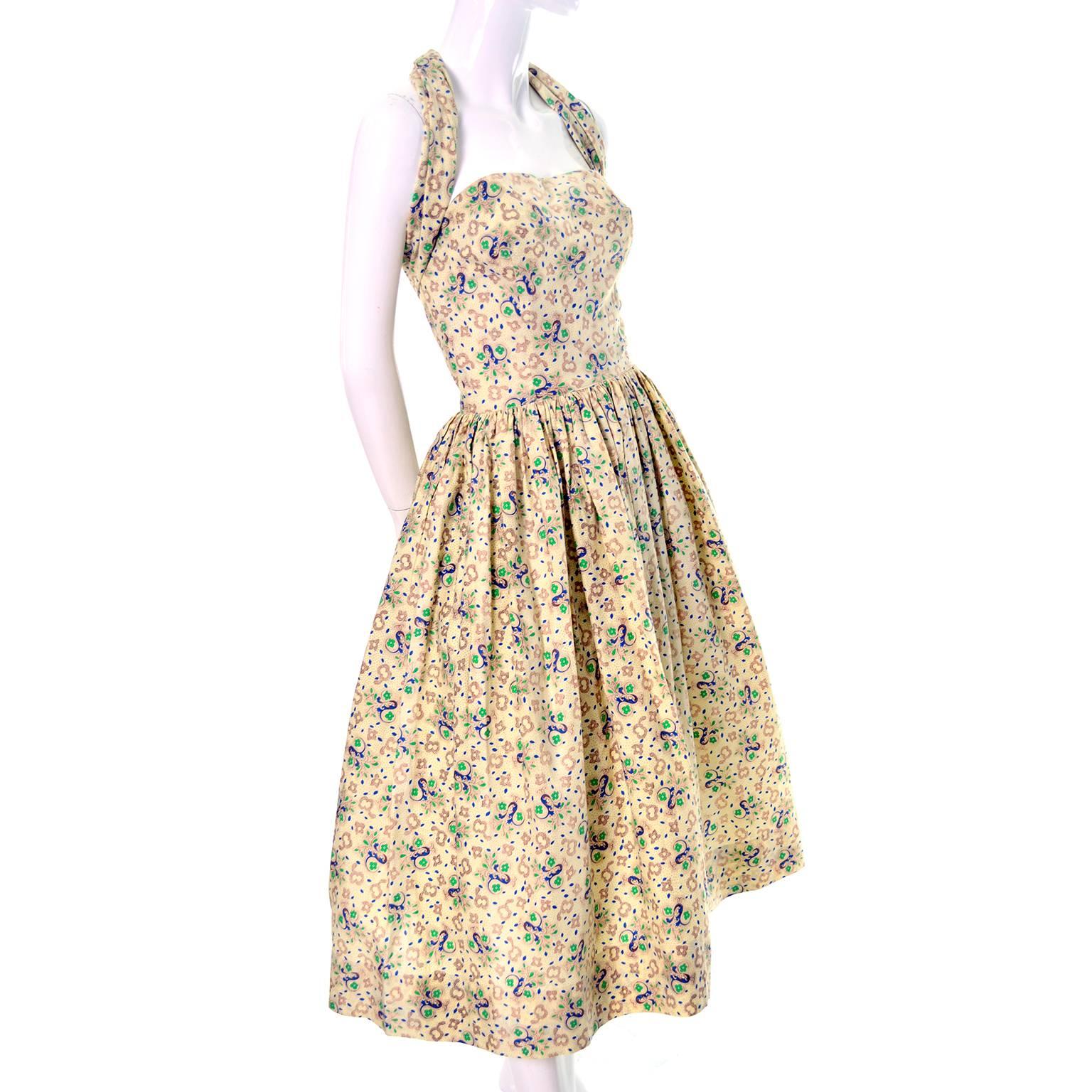 This cotton 1950's vintage dress was designed by the famous mid century designer Carolyn Schnurer.  The dress is strapless but has an attached piece of fabric that can be worn in a number of different ways as I have shown in the photographs. 