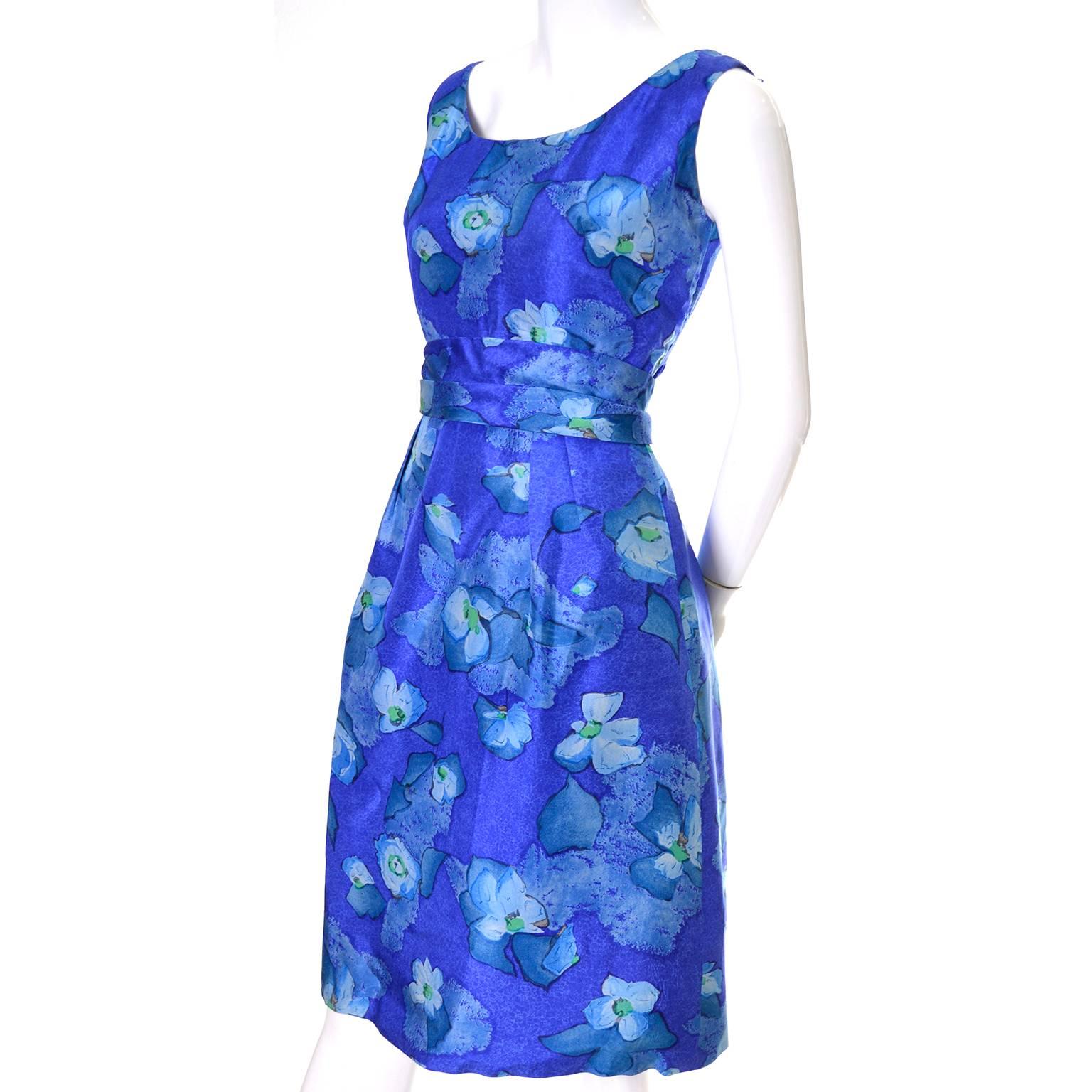 This blue floral vintage cocktail dress was designed in the 1960's by Betty Clyne and was sold at Bergdorf Goodman under the 