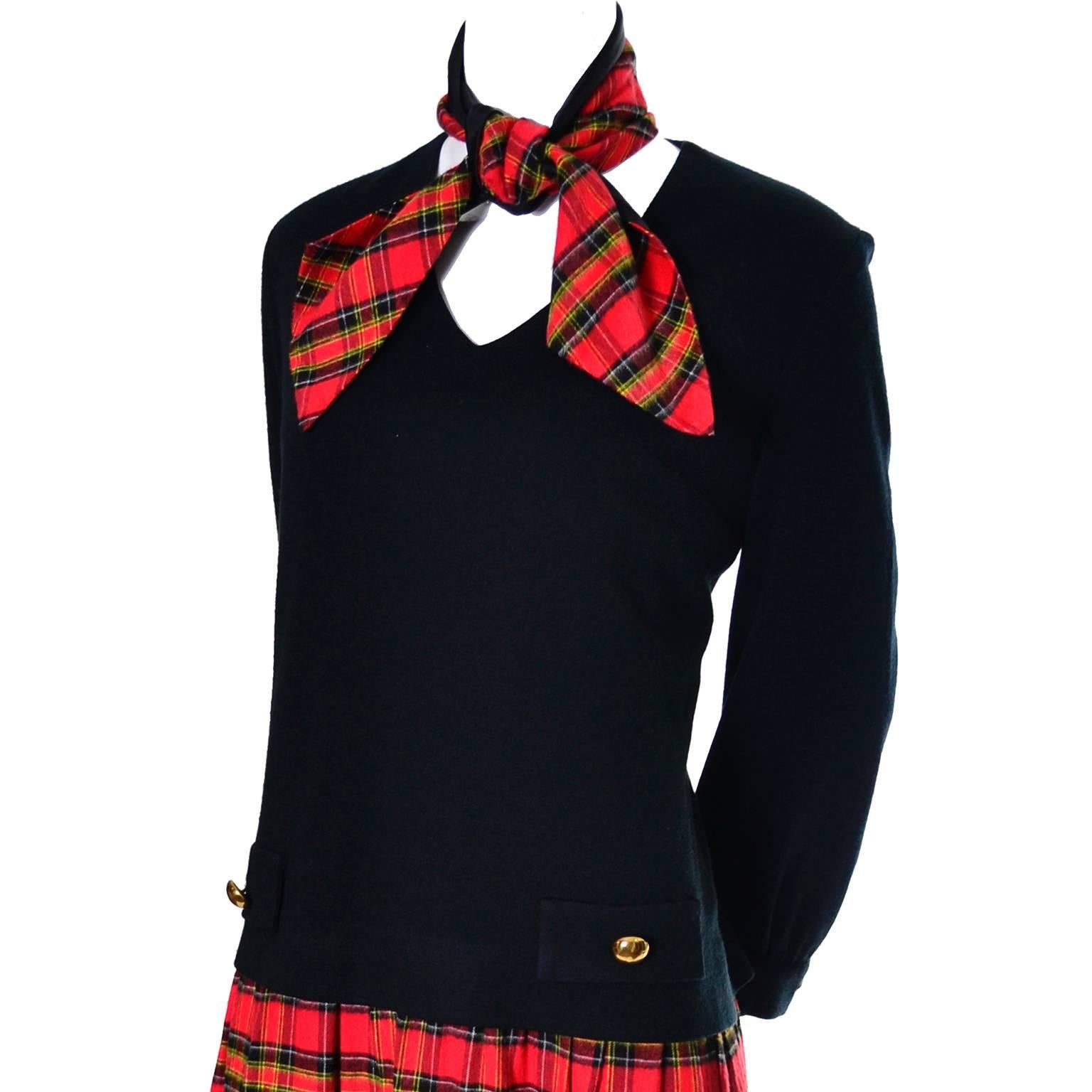 This vintage dress was designed by Jeannette Alexander in the 1960's. The lined top portion of the dress is in a black knit and the softly pleated skirt and scarf are in a plaid flannel.  This dress has a back zipper and I estimate it to be a modern