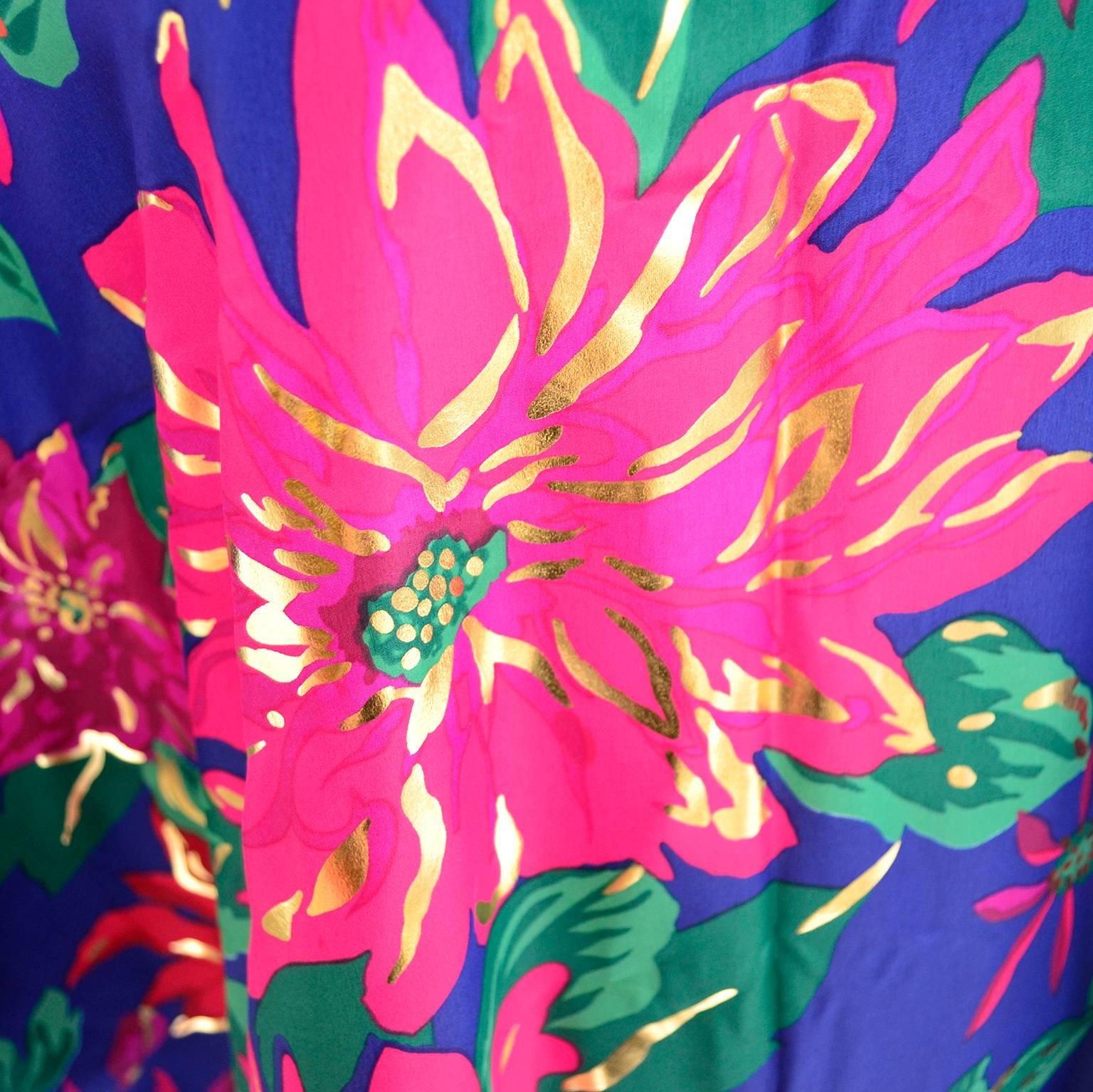 This bright floral vintage caftan was designed by Oscar de la Renta for Swirl in the 1980's and was made in the USA of imported fabric. This beautiful statement piece appears to have never been worn and measures 80 inches in circumference around the