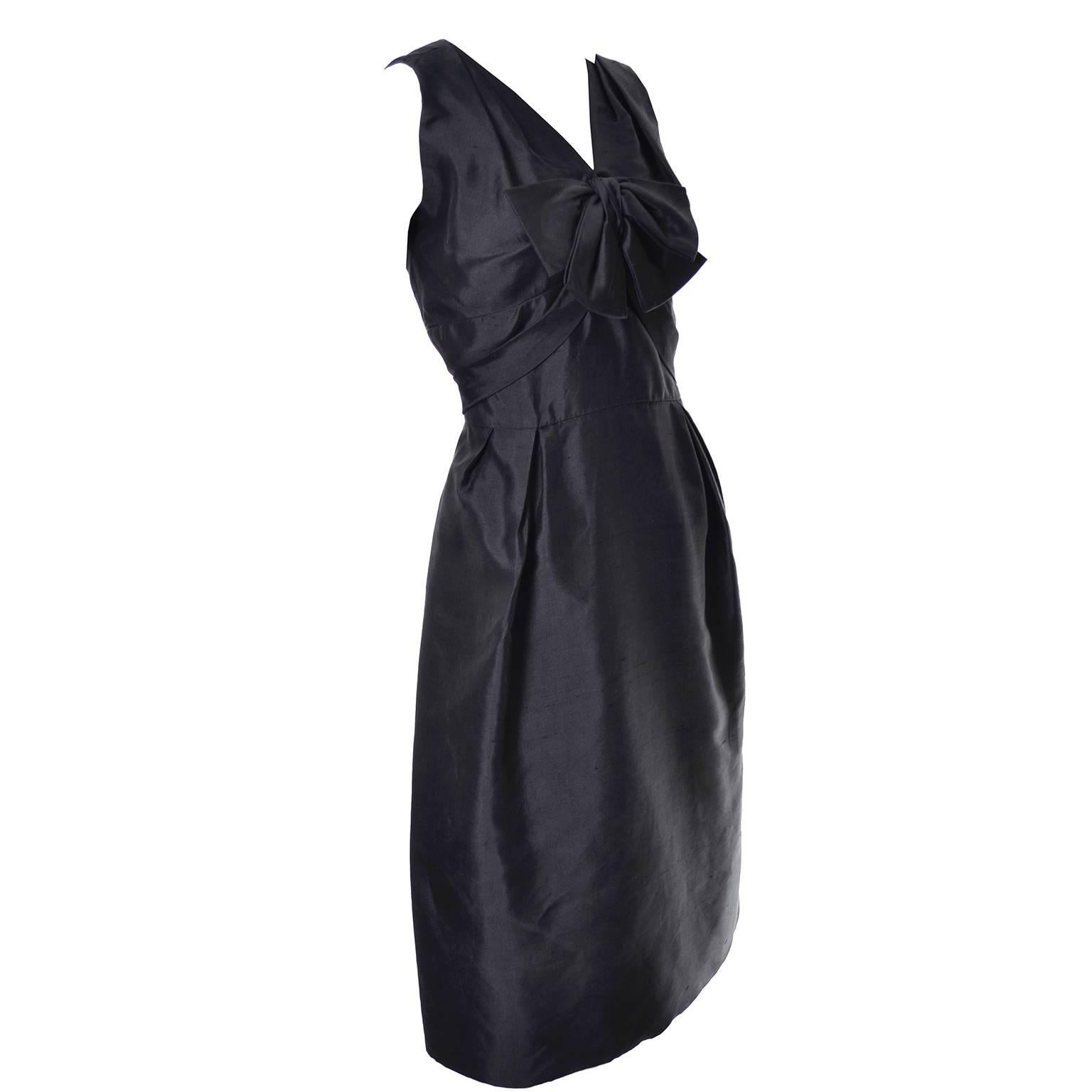 I love this vintage little black dress! This sensational black silk sleeveless dress was designed by Adele Simpson and purchased at the exclusive boutique Nicholas Ungar in the late 1950’s. I love the bow on the bodice and the sash that drapes from