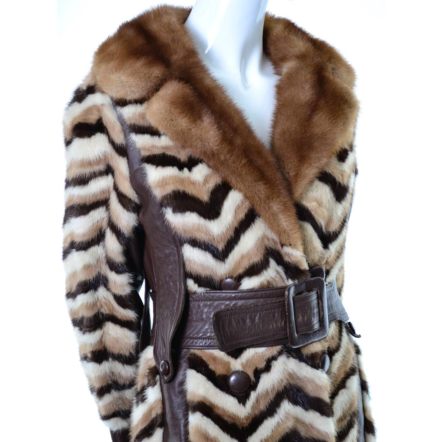 This is an extraordinary vintage mink, leather and dyed fur coat from designer Donald Brooks.  The coat has tri-color fur on the body and a pretty natural mink collar.  There are leather details including leather panels, buttons, collar lining, and