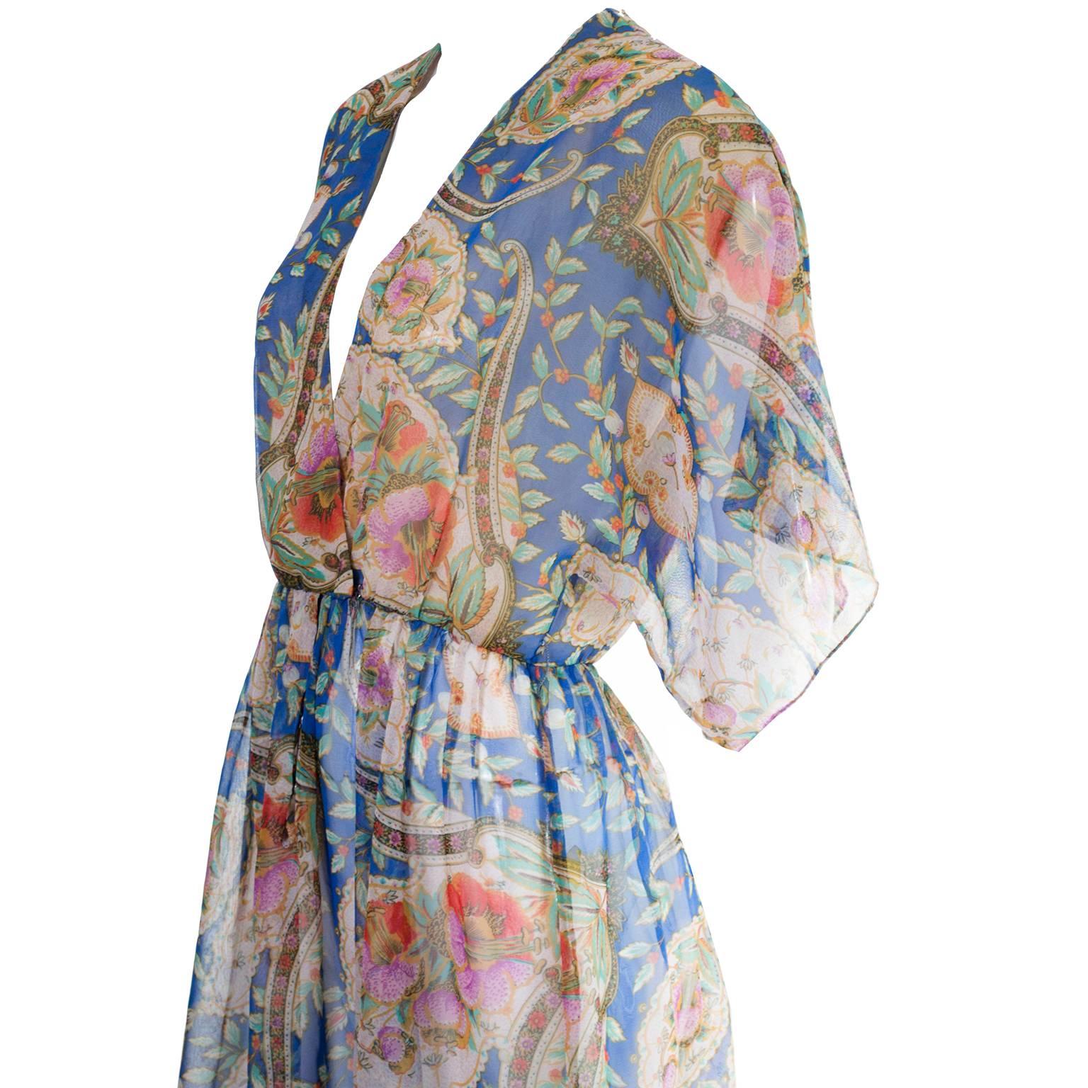 This dreamy size 6 floral chiffon dress was designed by Albert Capraro and was sold at Saks Fifth Avenue in the late 1970’s.  If you are't familiar with Capraro, he started his career at Lily Dache and then went on to work as Oscar de la Renta's