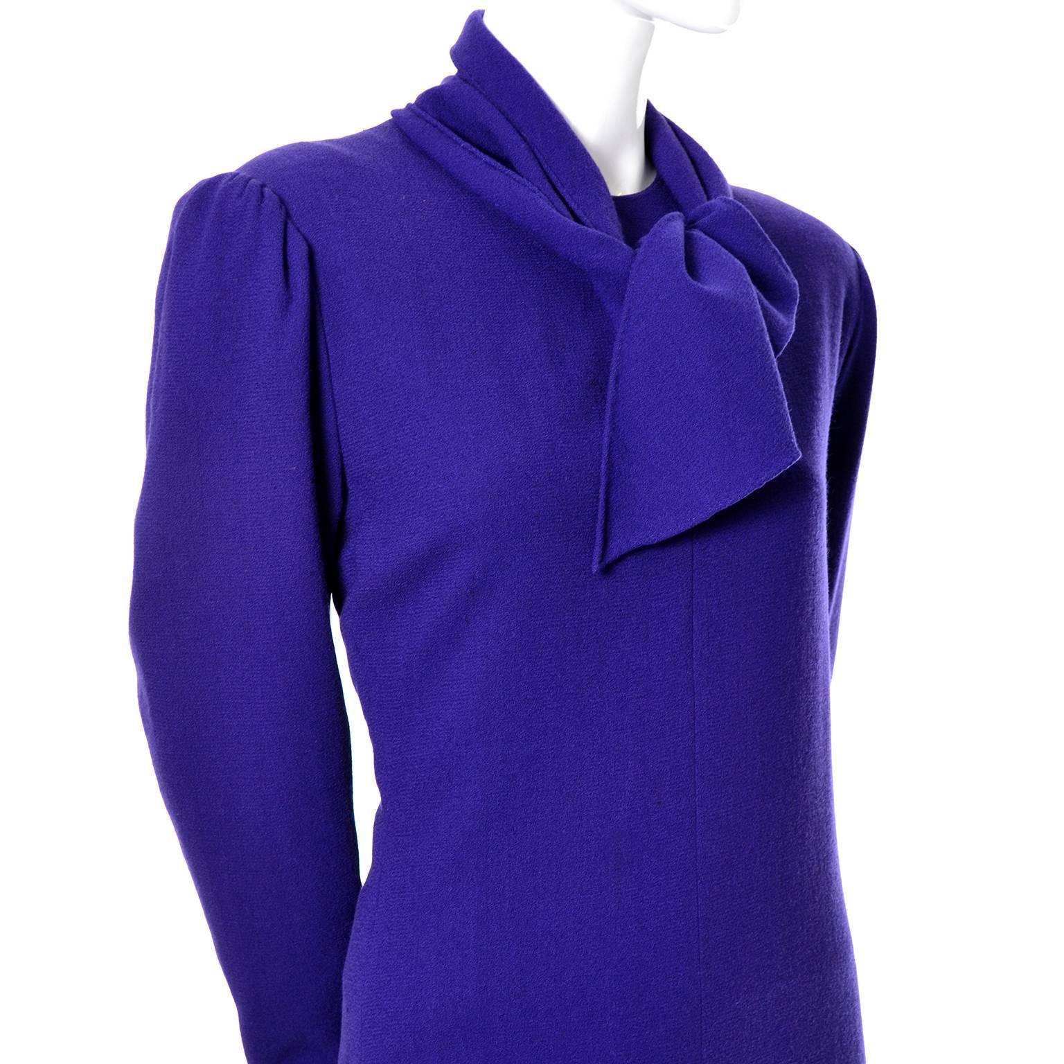 This timeless Pauline Trigere deep purple fine wool vintage dress has a sewn in sash at the neck and Trigere's trademark zippers on the sleeves.  The dress is fully lined, has shoulder pads, and closes with a back zipper.  This great, versatile